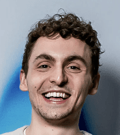 A smiling young man with curly brown hair and bright eyes, exuding enthusiasm for digital product innovation.