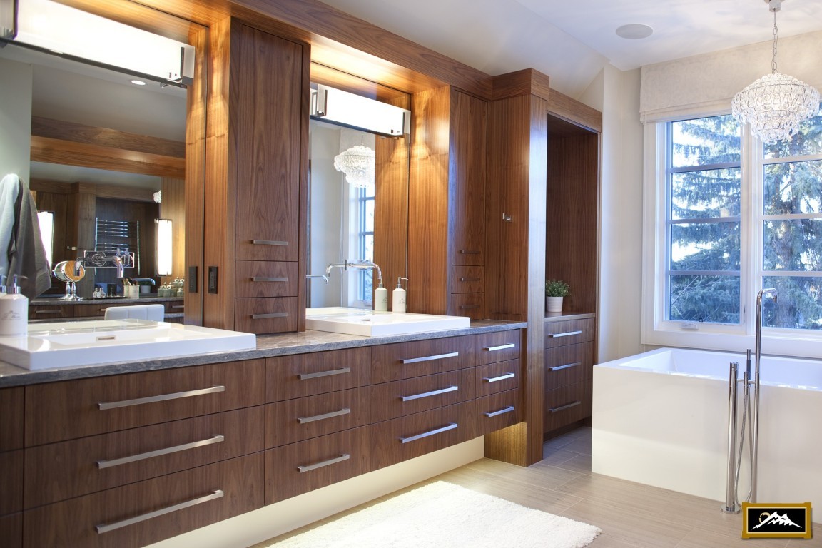 Image of Luxurious bathroom design by KHD Homes featuring a spacious primary ensuite with modern furniture and window coverings.