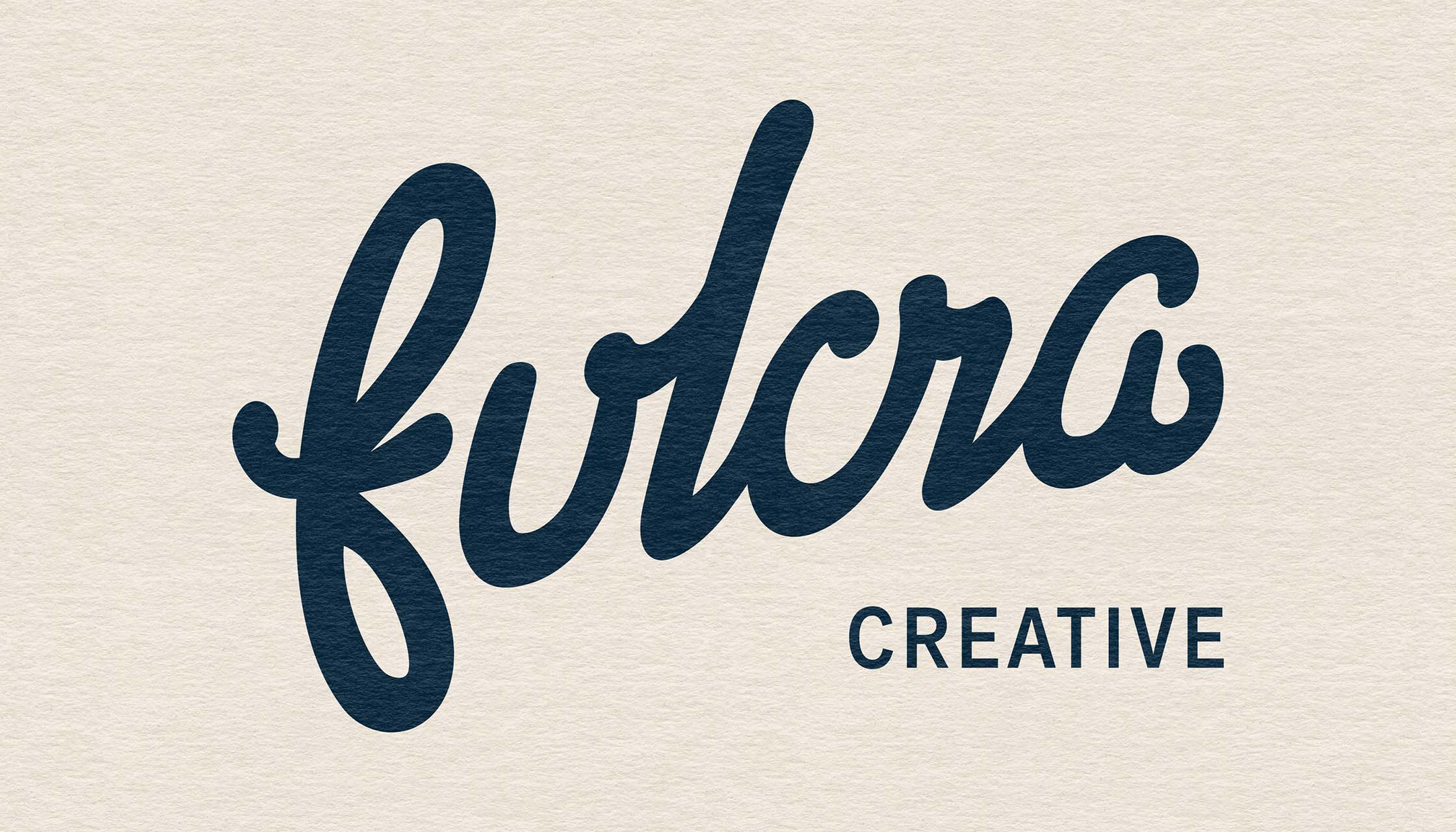 Fulcra Creative Custom Logo in blue on a textured background