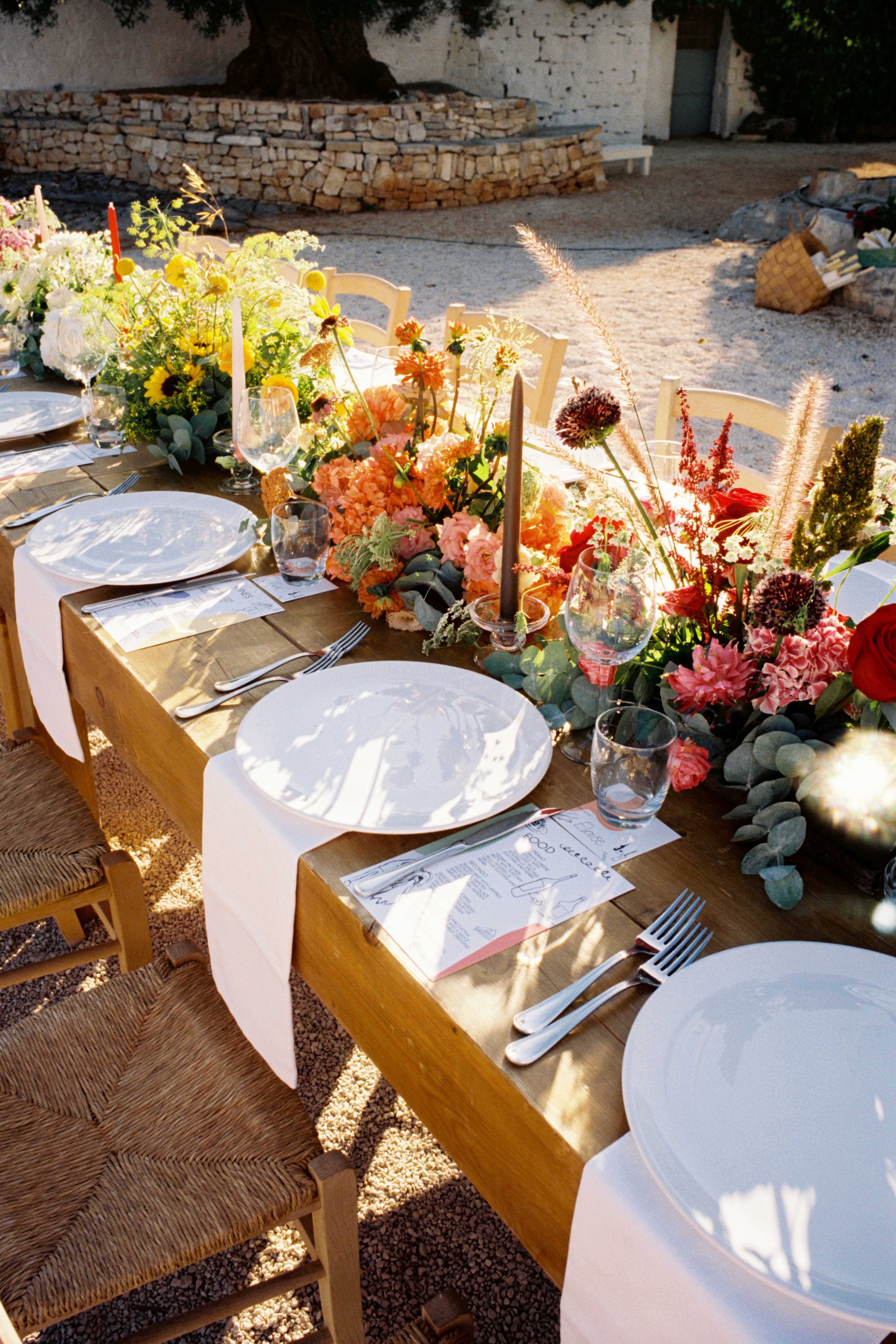 Wedding tables set for an outdoor summer reception in Puglia