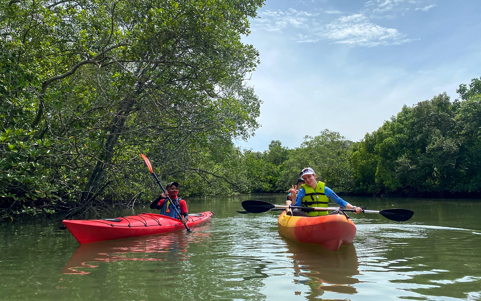 People kayaking in the mangroves around Ketam Island on a kayaking adventure from Pulau Ubin to Ketam Island.