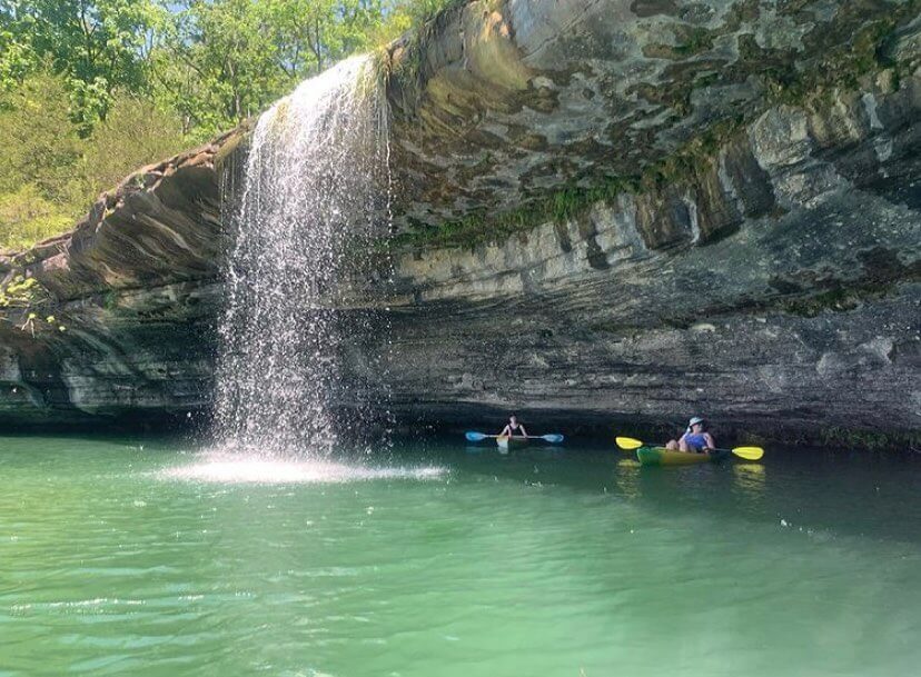 white and brown wooden house near swimming pool during daytime