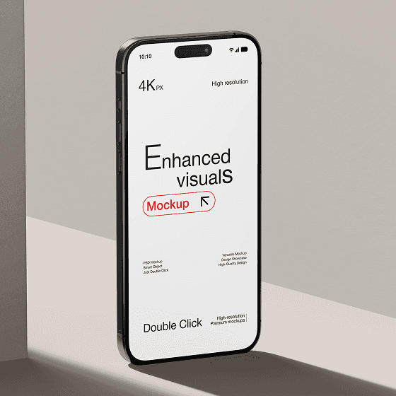 Smartphone mockup standing on a minimal beige surface displaying “Enhanced visuals” on the screen.