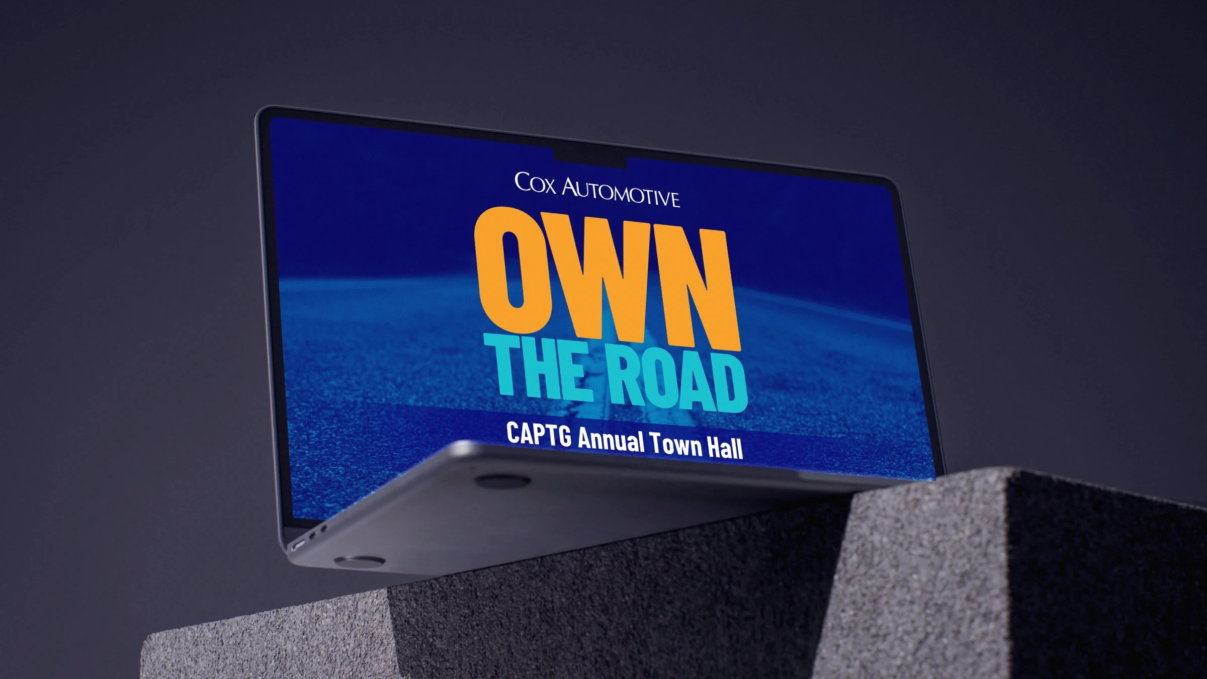 Laptop mockup showing Cox Automotive presentation design