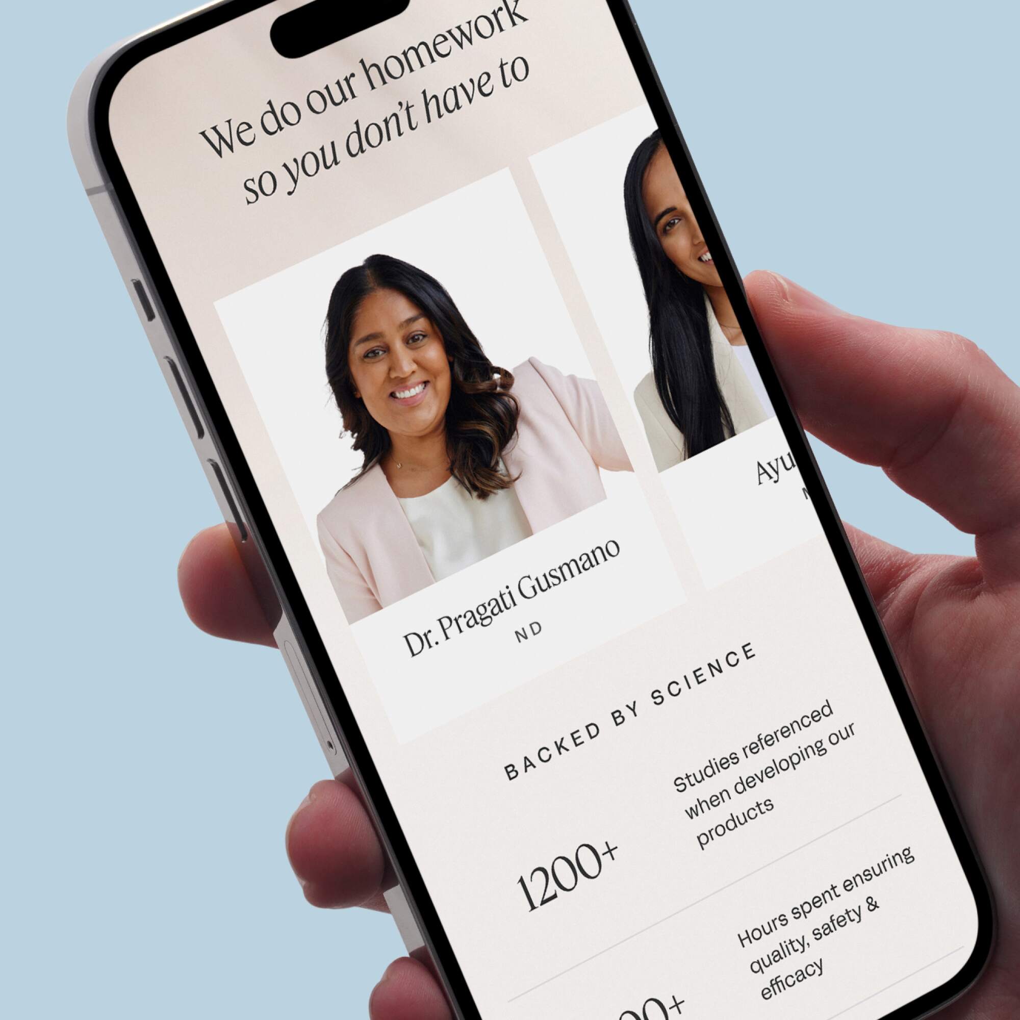 Hand holding a smartphone showing the Care/of interface with profiles of Dr. Pragati Gusmano and another expert, highlighting the science-backed approach.