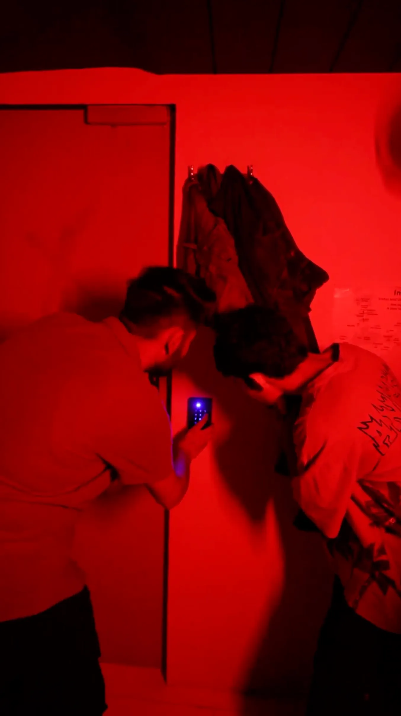 Team exploring dark corridors in The Haunted Hostel escape room – a spine-chilling mystery room near me