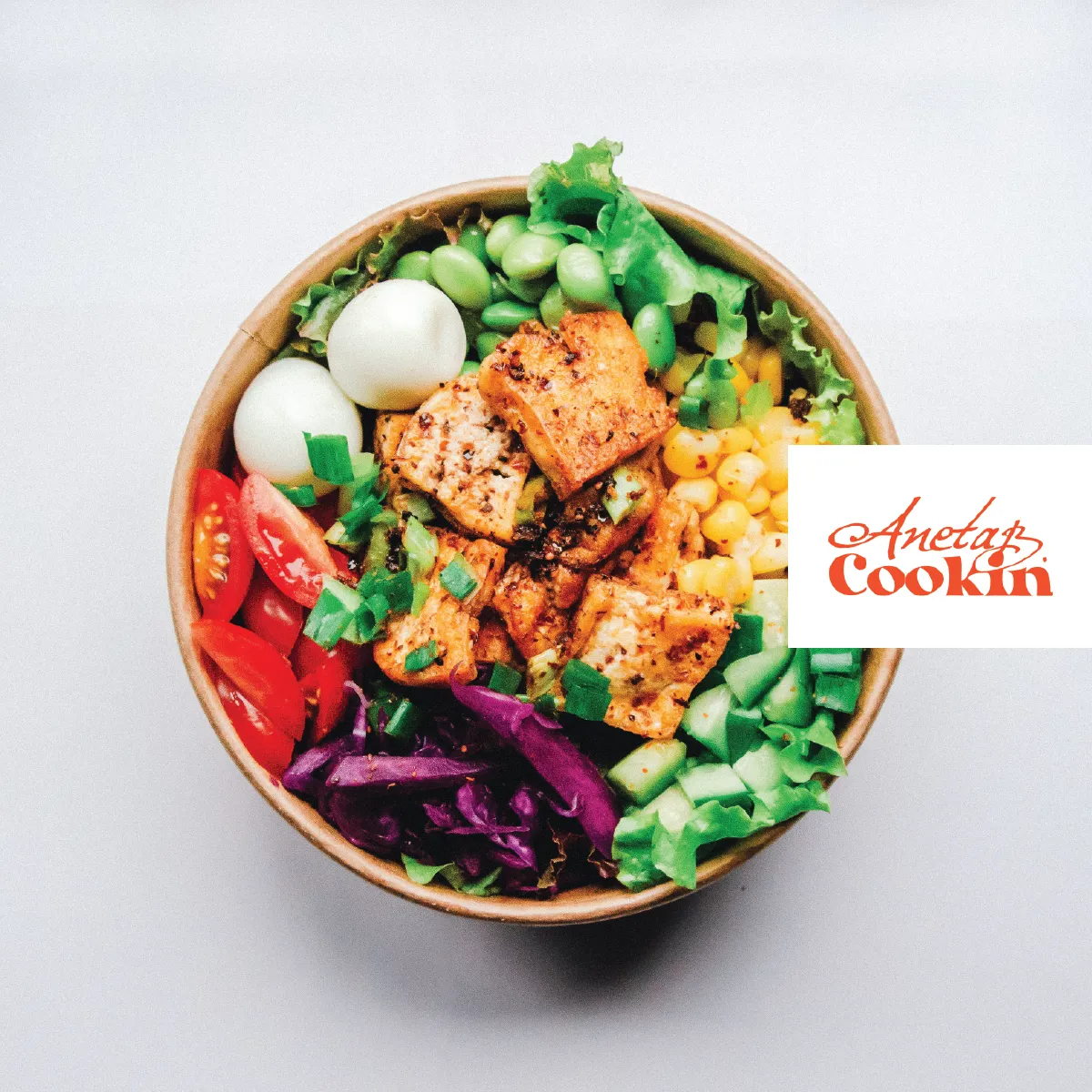 Aneta B. Cookin logo on takeout food packaging mockup, brand identity designed by The World District.