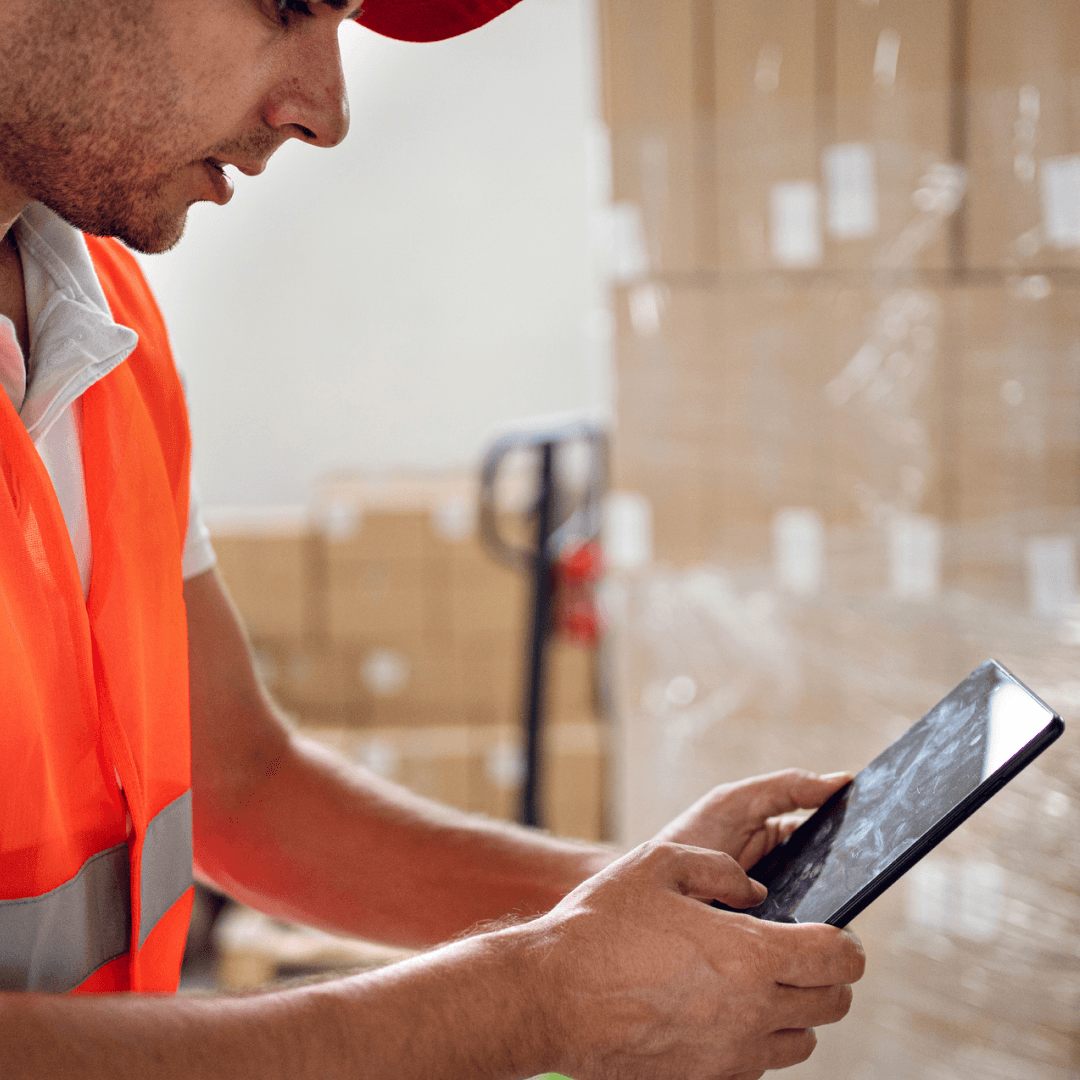 Logistics professional capturing load documentation on mobile app for improved accountability and risk management