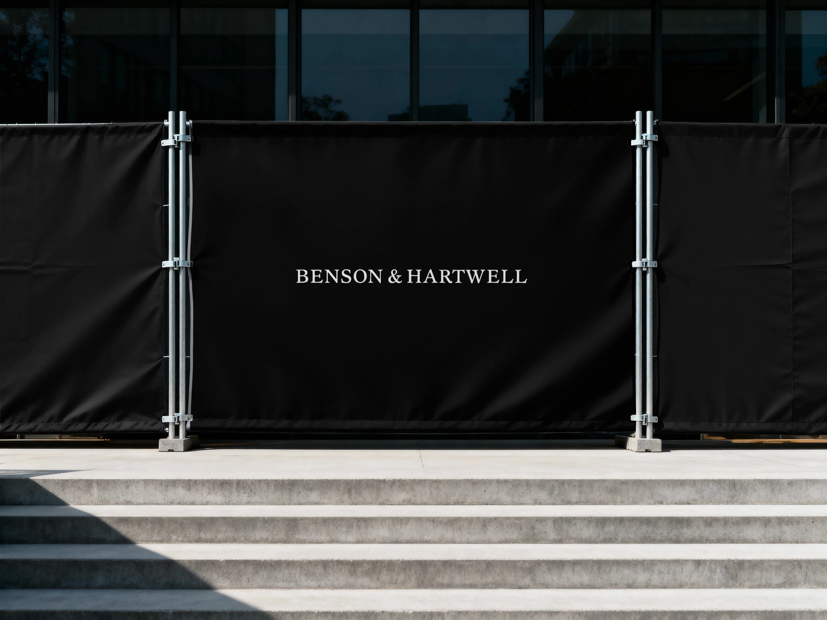 Landscape architect reviewing planting plans and material samples outdoors.