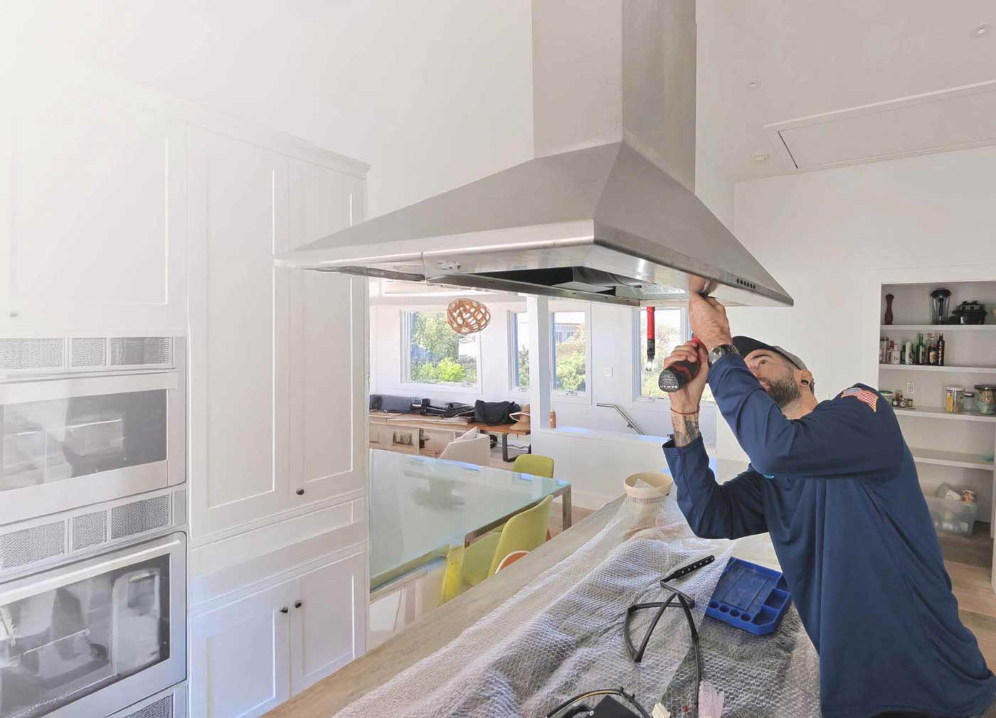 JIC woker repairing ventillation issues