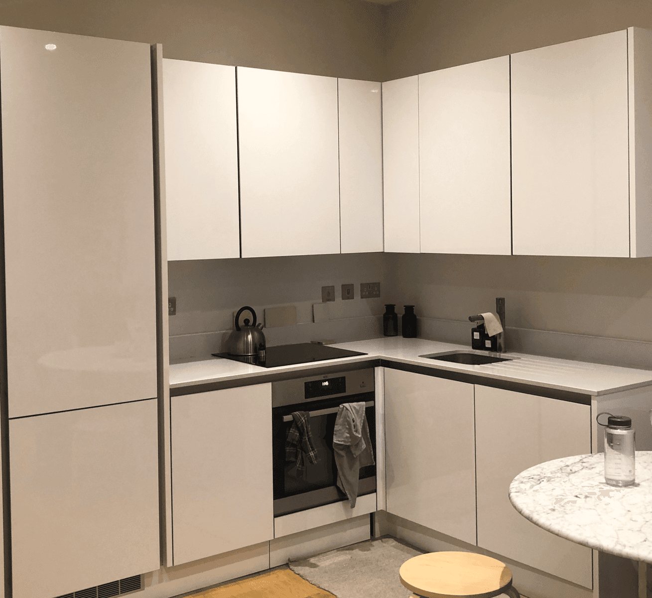 Before: dated kitchen with standard cabinetry and inefficient layout