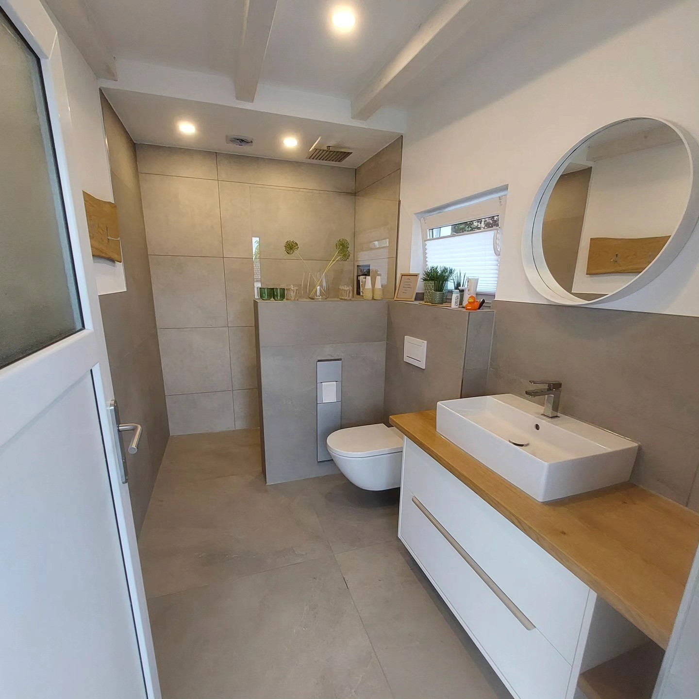 woman sitting around table holding tablet