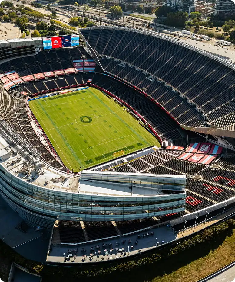 Aerial view of modular stadium construction showcasing scalable venue architecture.