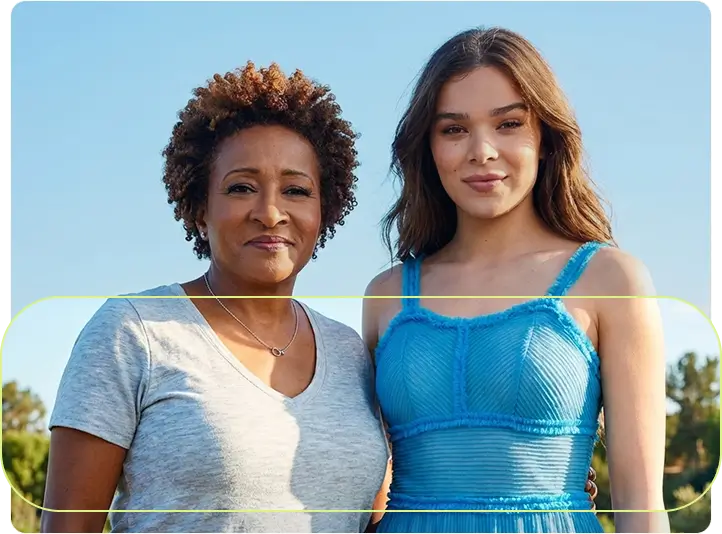 Your Attention Please advocates Wanda Sykes and Hailee Steinfeld standing confidently together.