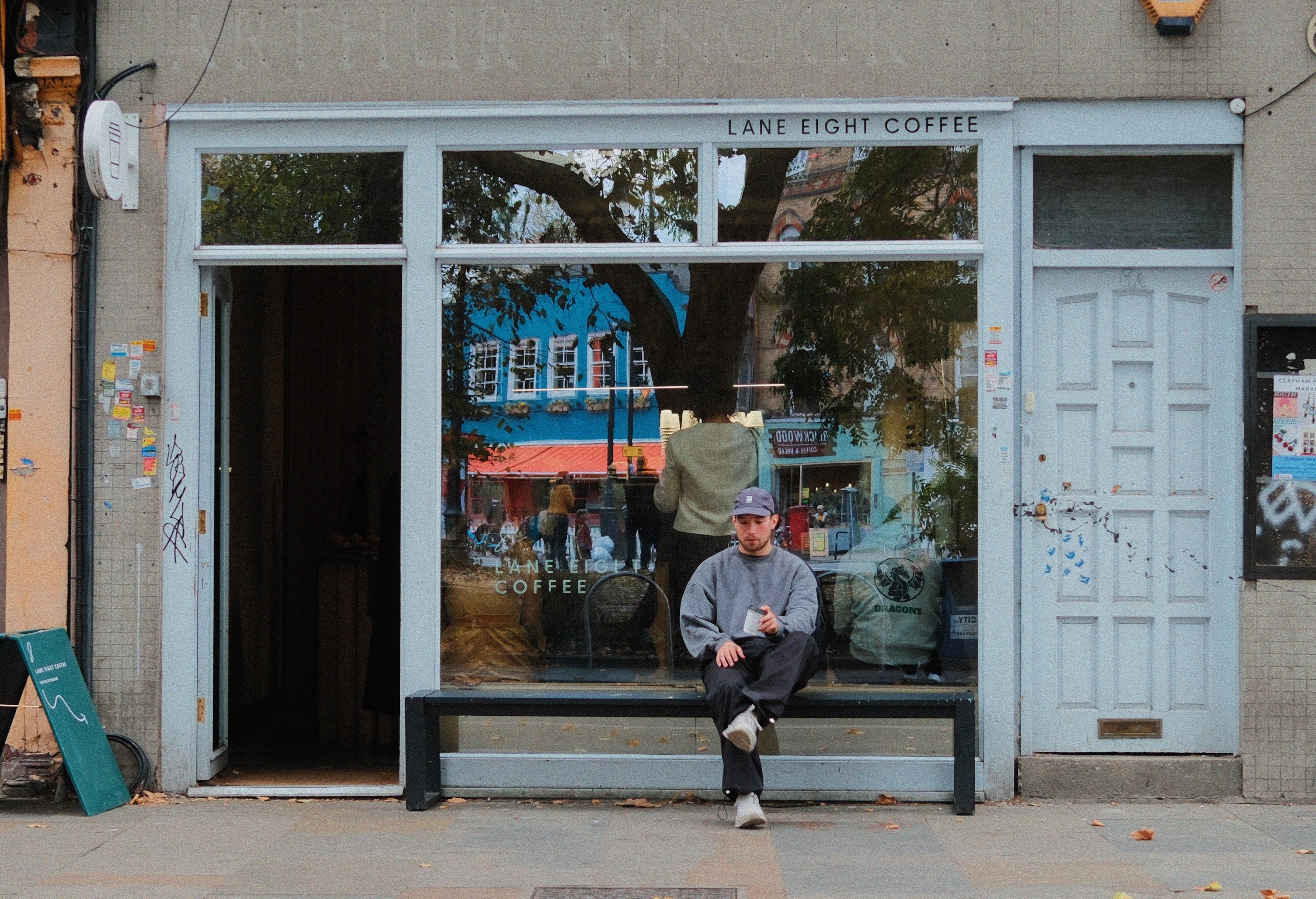 Man sitting by himself on a bench in a park