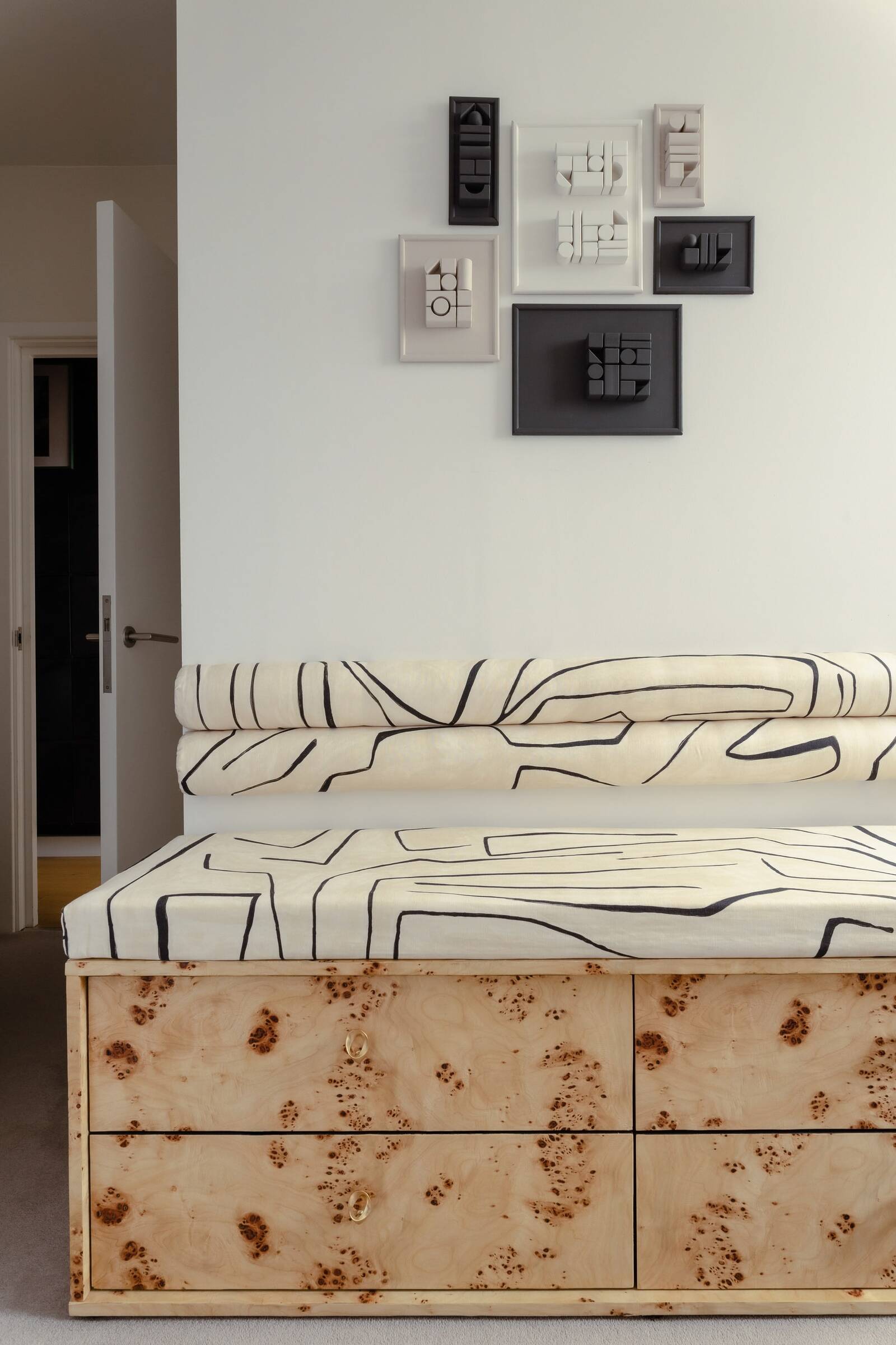 Bespoke burlwood bedroom storage bench in London new build interior design by Atelier Akuko.