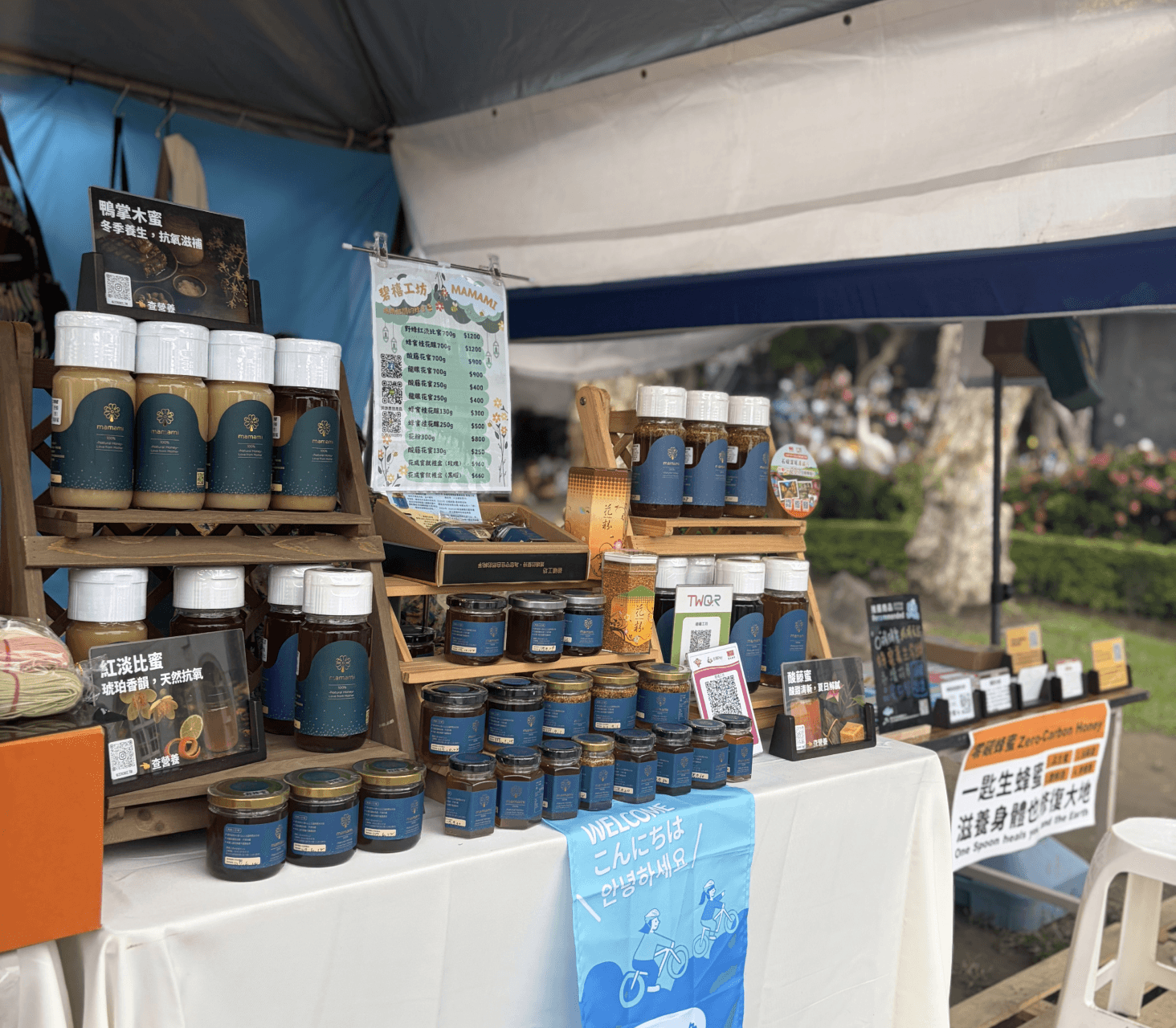 A man stading with Surfboard
