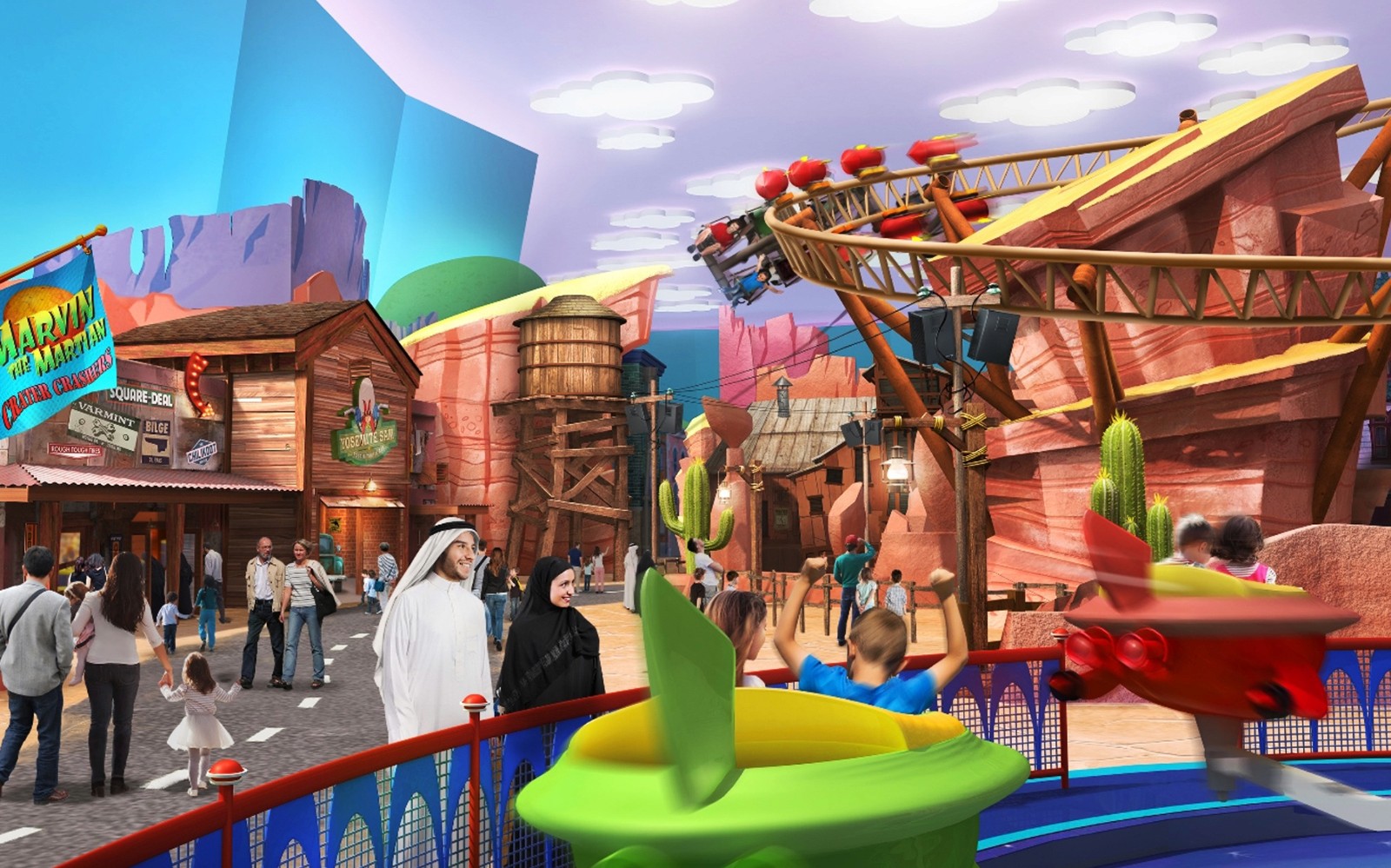 Warner Bros. theme park with families enjoying rides and attractions in Abu Dhabi.