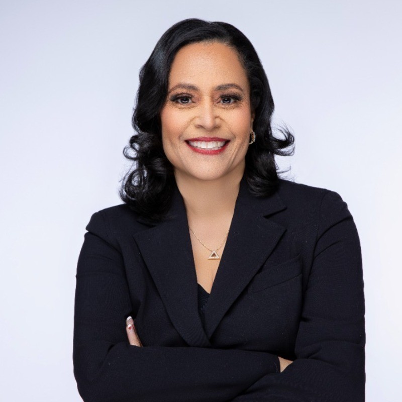 woman in red cardigan smiling