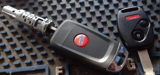 Honda car keys inserted in a rebuilt ignition lock repaired by CarKeyAction in Calgary