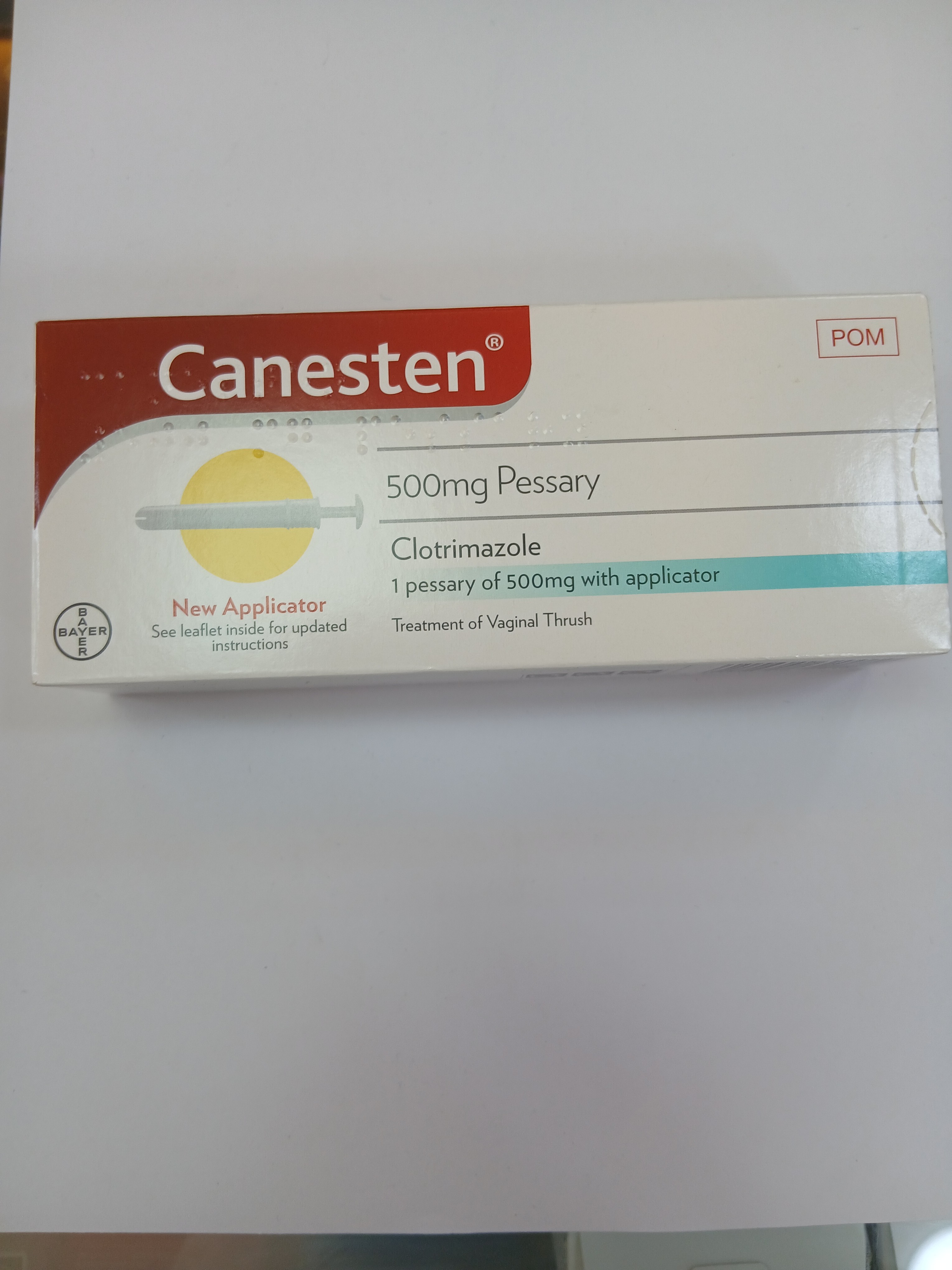 White cardboard box packaging displays a red and yellow label with text, featuring a clear plastic window revealing a single 500mg pessary with applicator inside.