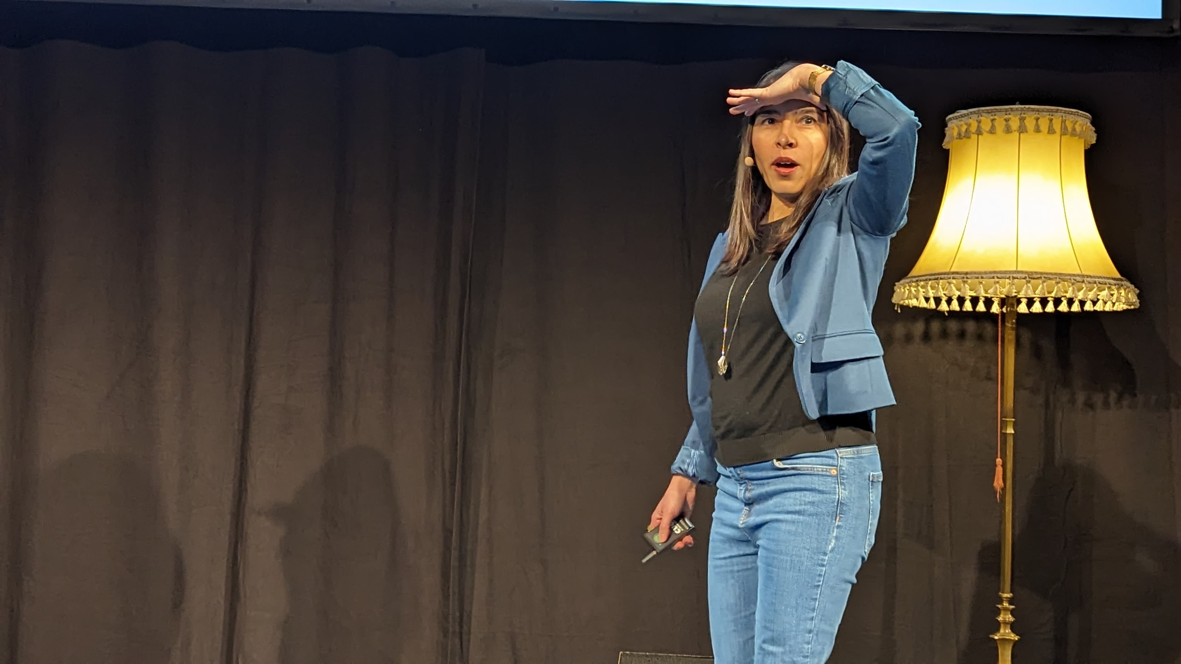 person sitting on grass and using phone