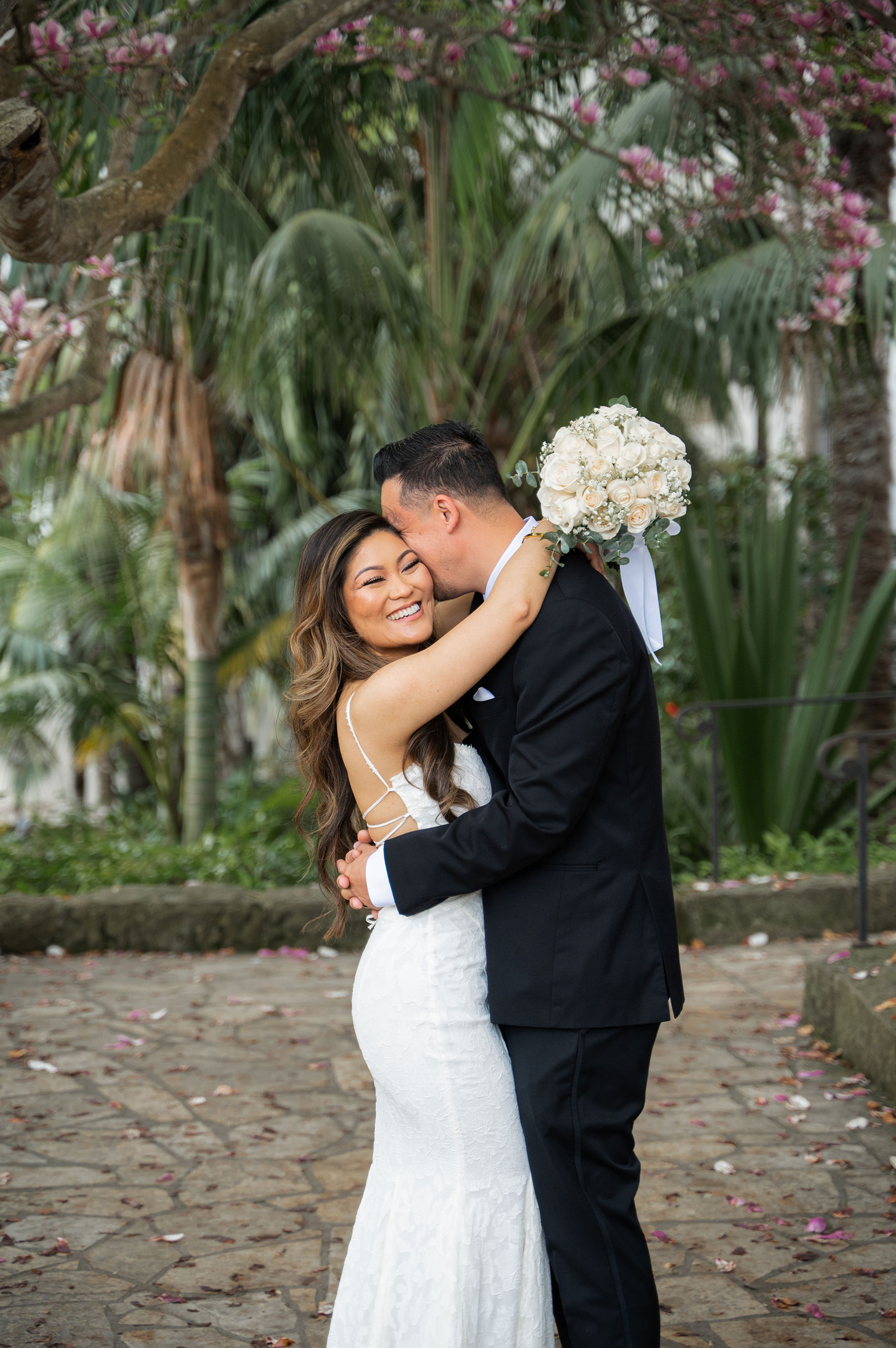 Close-up couple portrait at Santa Barbara Courthouse with courthouse details behind them