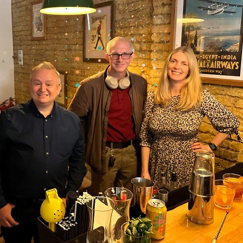 three Lean Tree employees meeting at a company event
