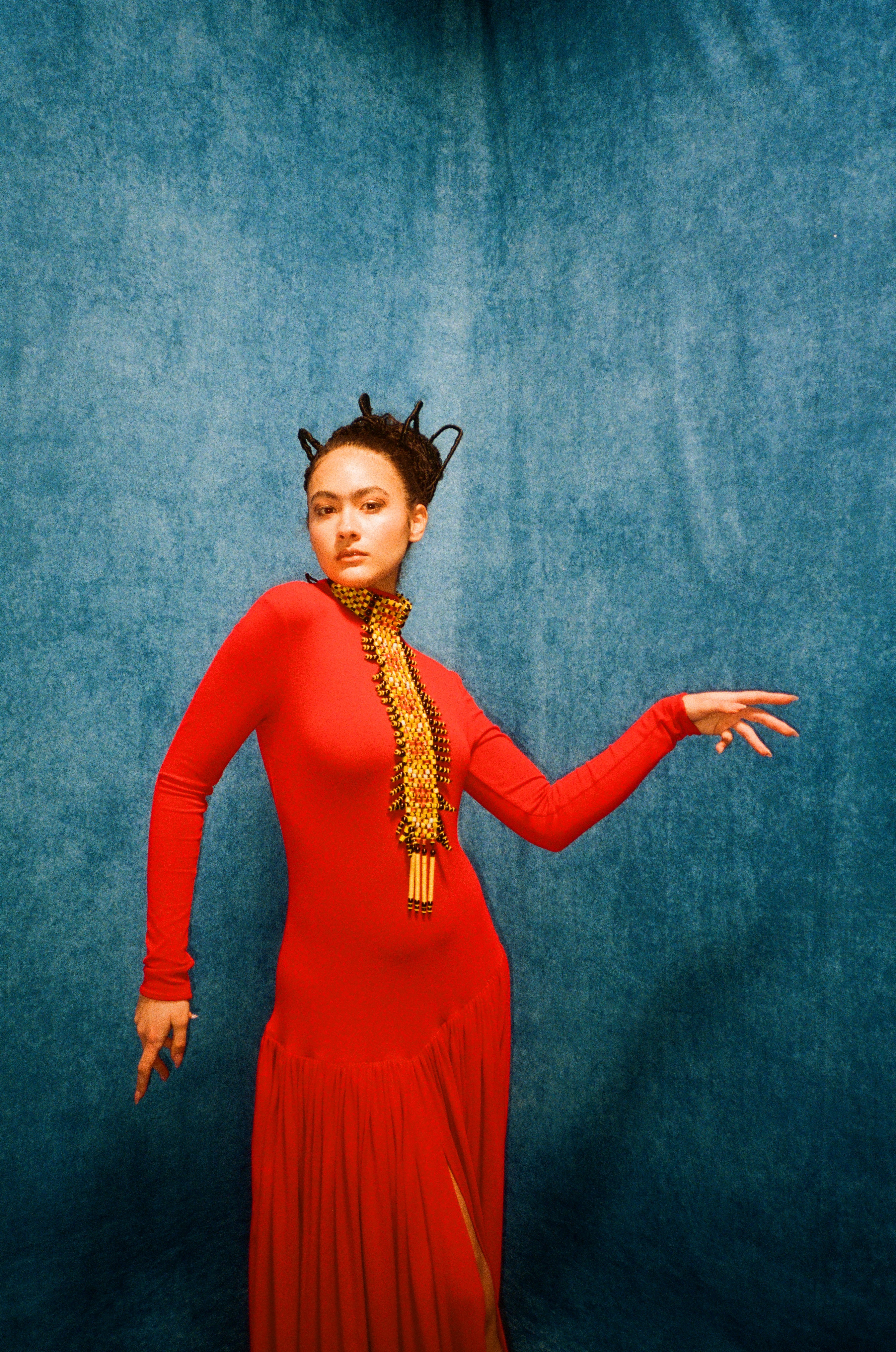 Woman with red hair covering mouth with hair