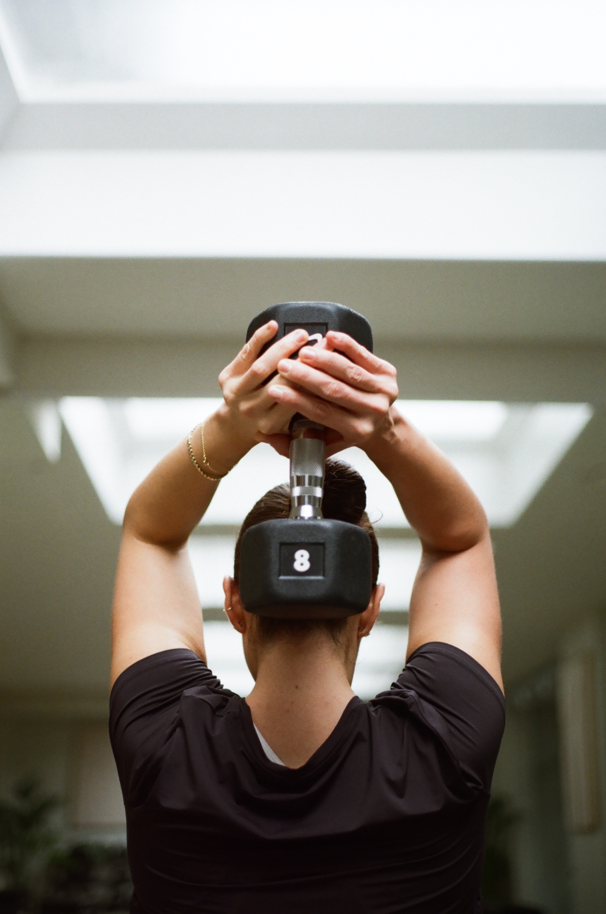 three women kneeling inside building at daytime