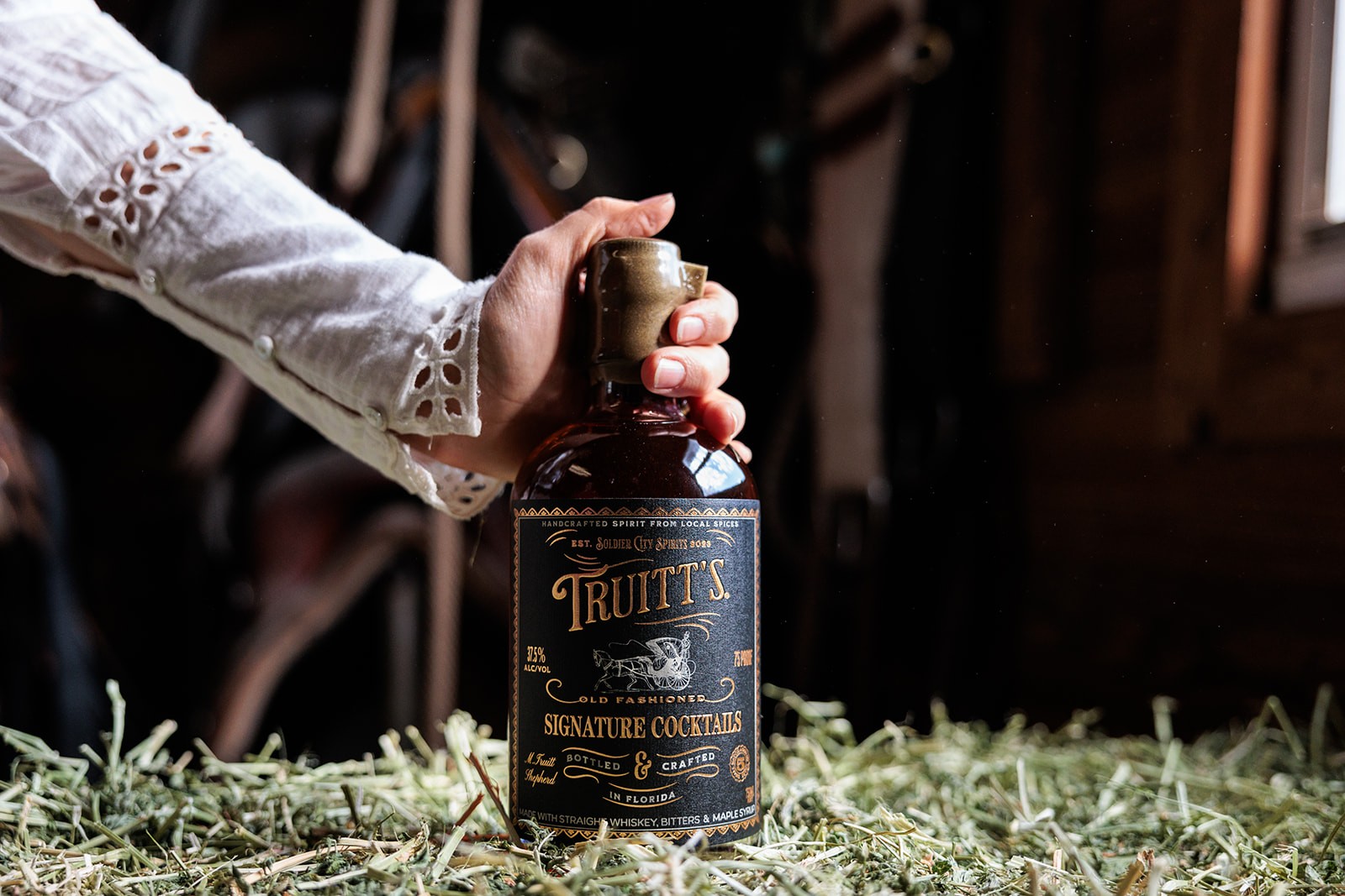 Hand holding Truitt's Old Fashioned bottled cocktail from Soldier City Spirits