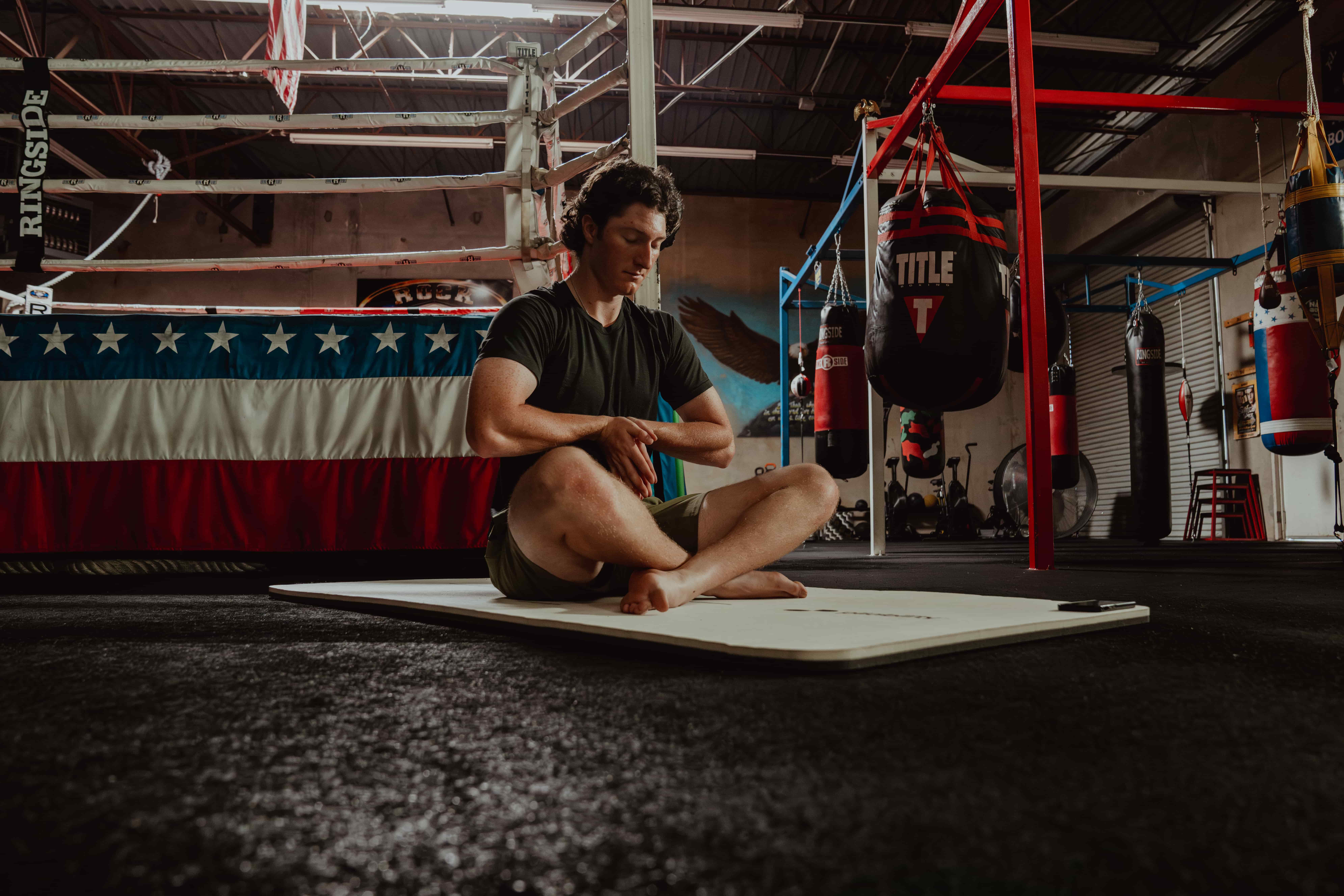 Man Stretching in Gym - Stretch Before Or After Workout