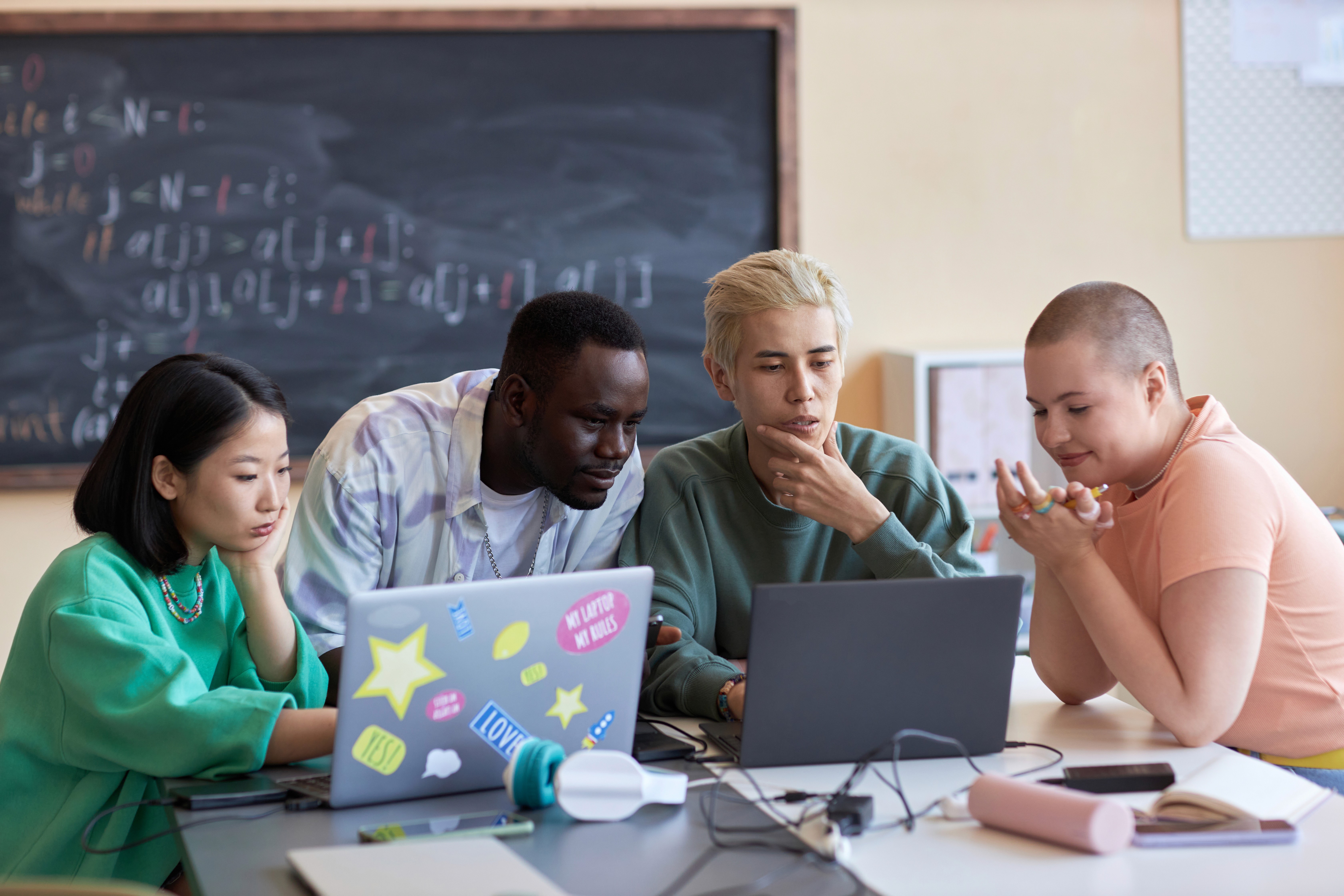 Group of teachers working with AI