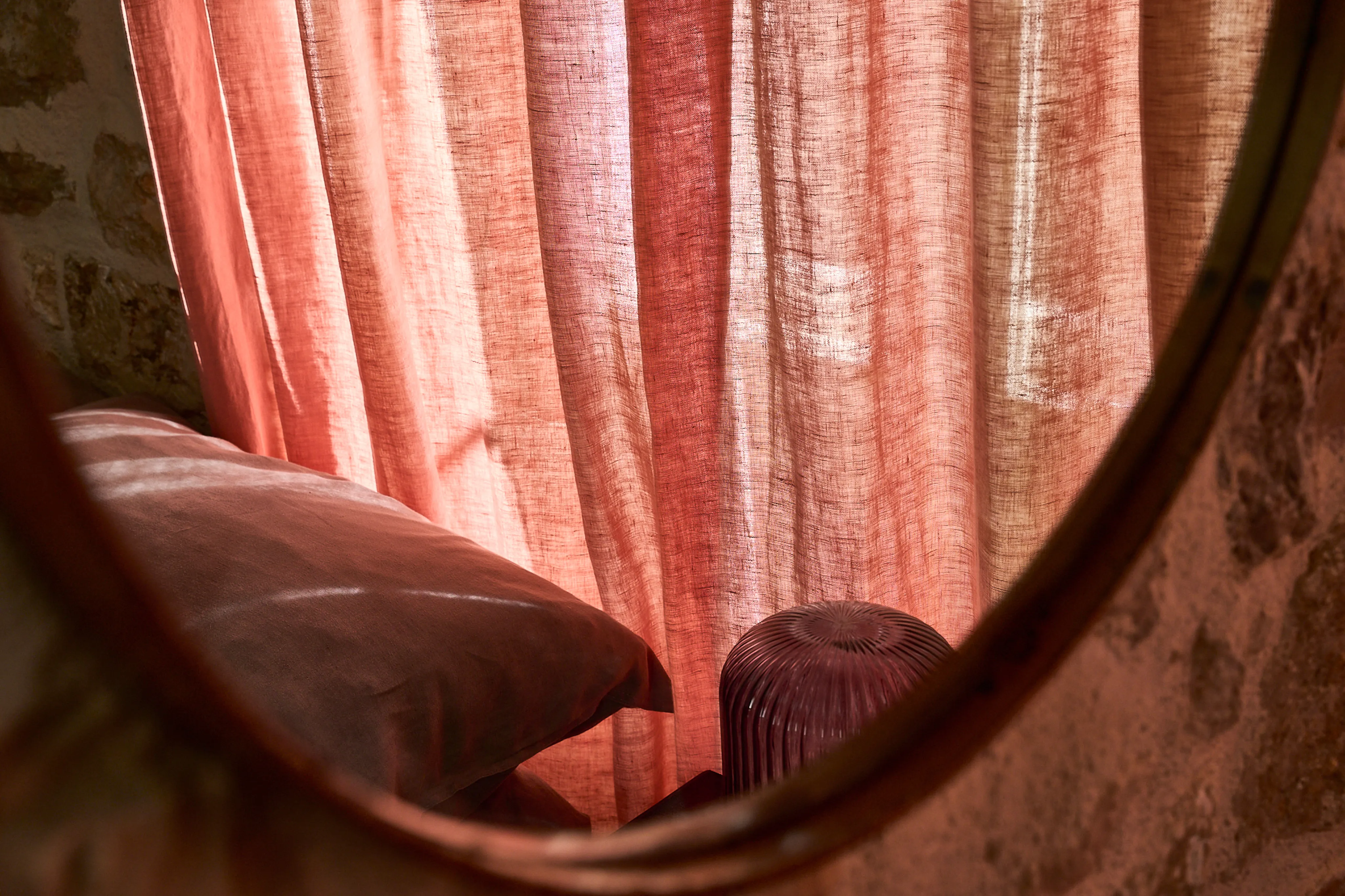 Bedroom detail with pink linen curtains and soft furnishings in the Lina Suite, Hidden House, Stari Grad Hvar