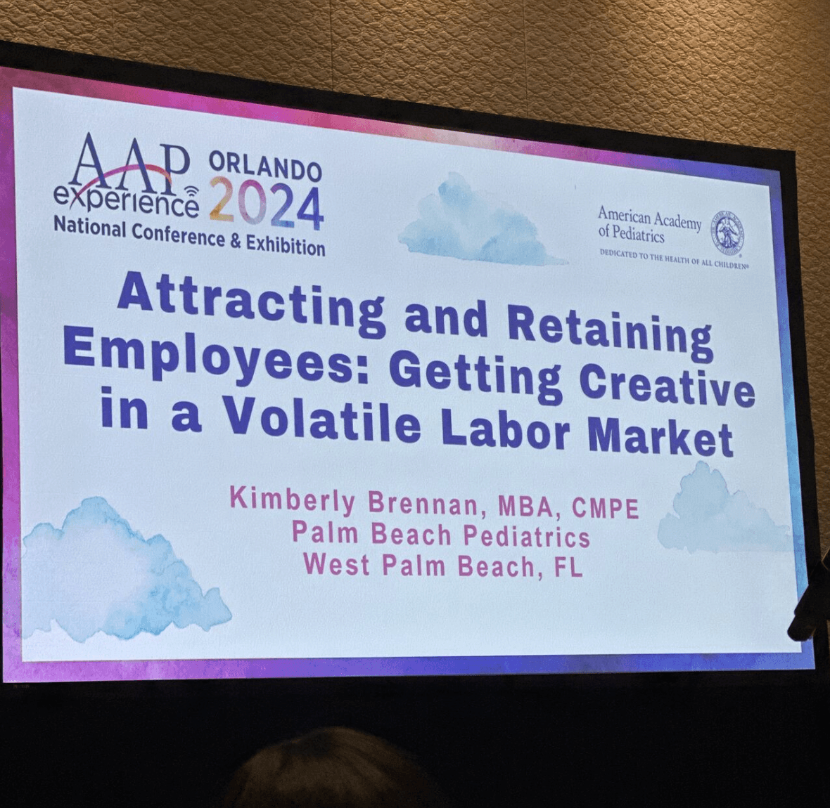 Photo of a presentation at AAP NCE 2024 showing the text "Attracting and Retaining Employees: Getting Creative in a Volatile Labor Market"; Image Source: Zhen Chan