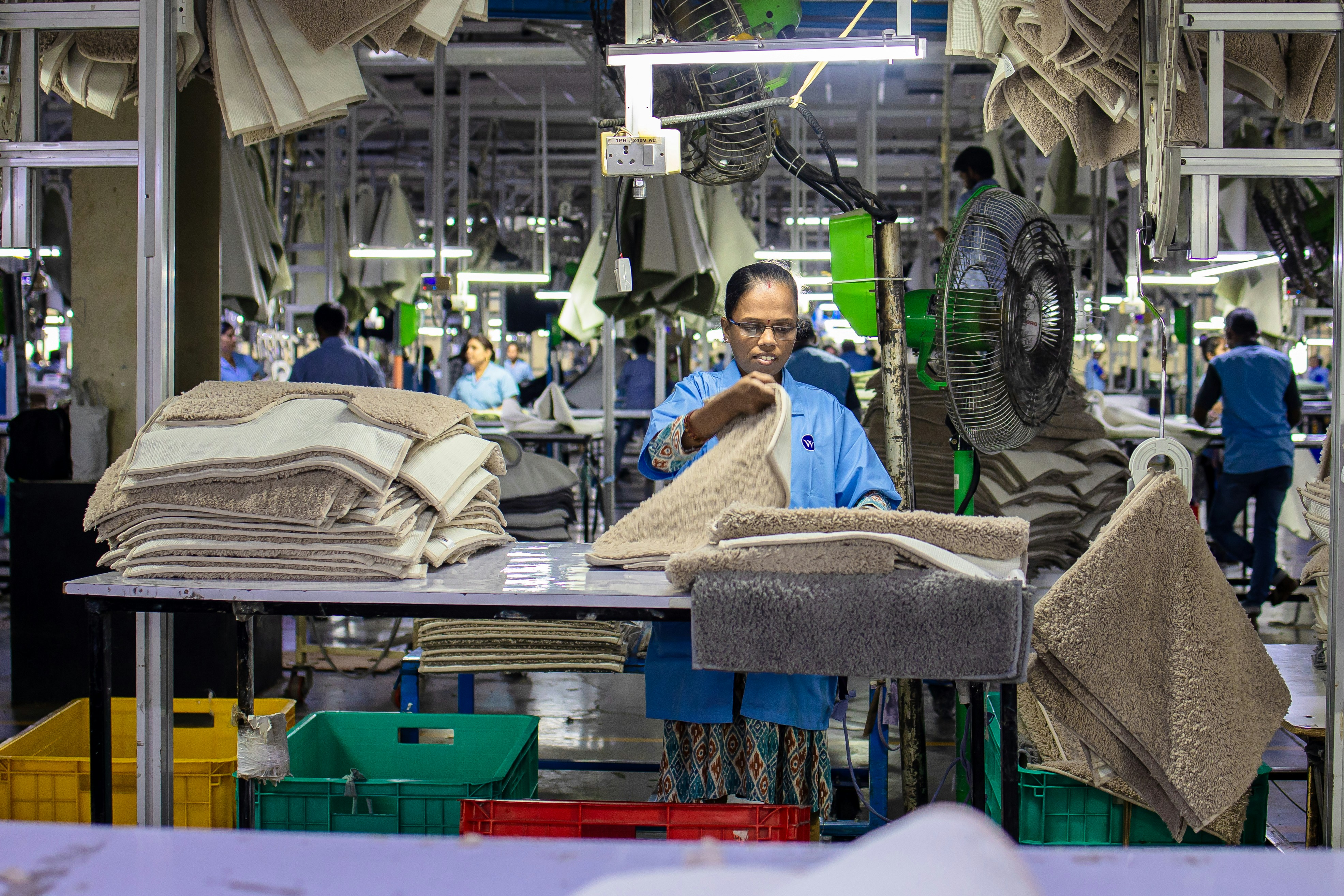 Workers are busy at work in a factory.