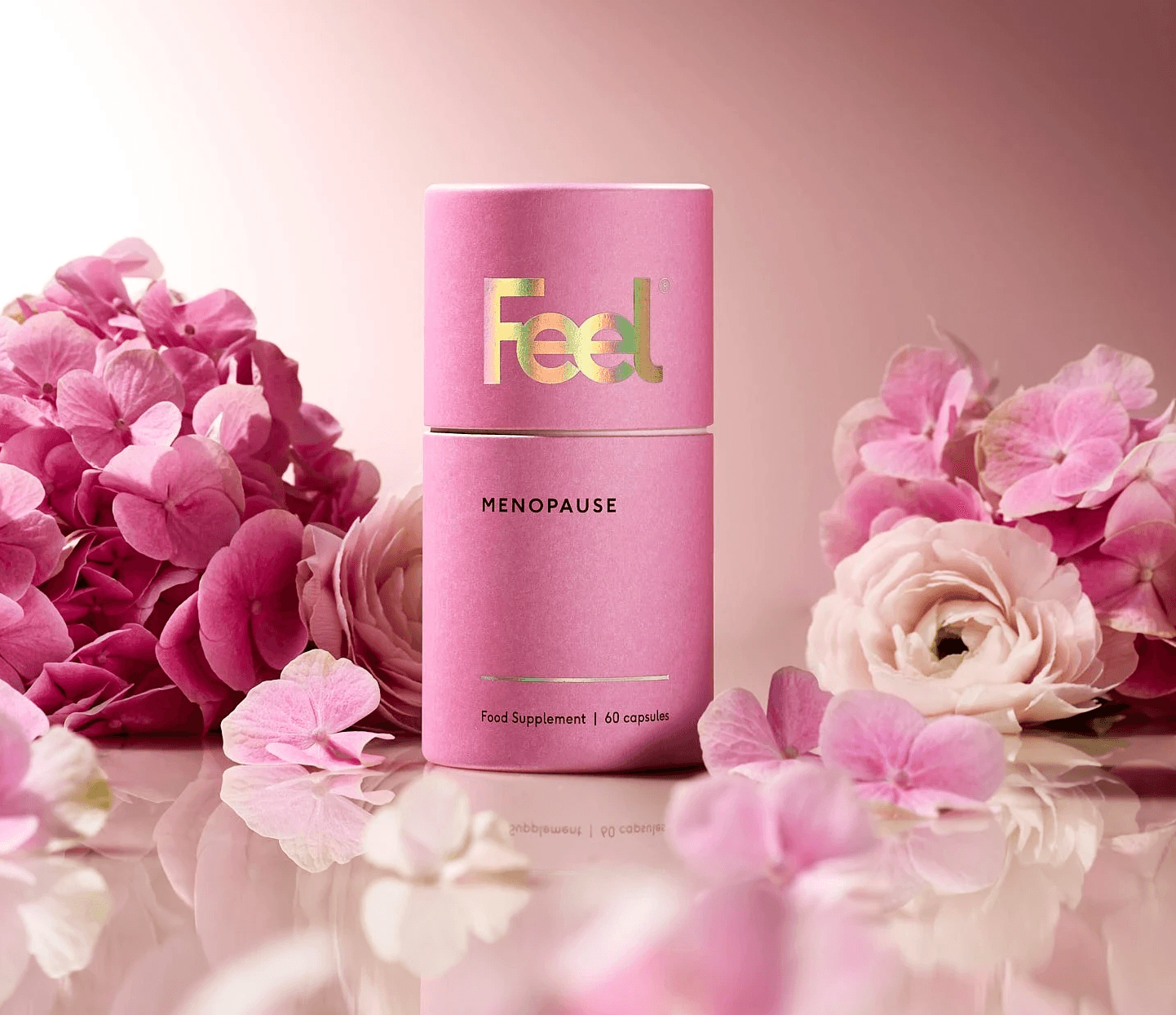 A pink hair care product surrounded by pink flowers, set against a soft, gradient background.