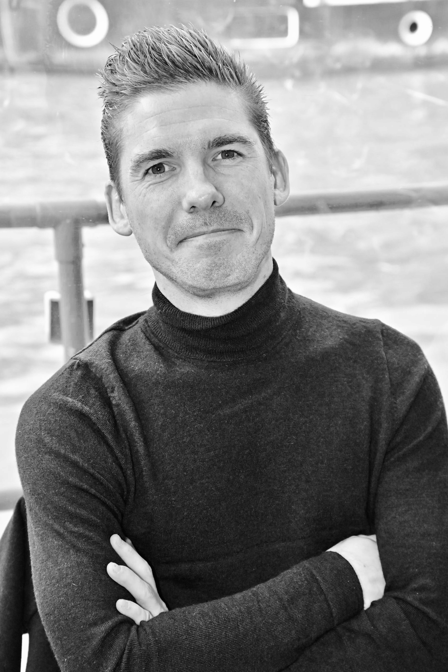 man wearing black crew-neck shirt