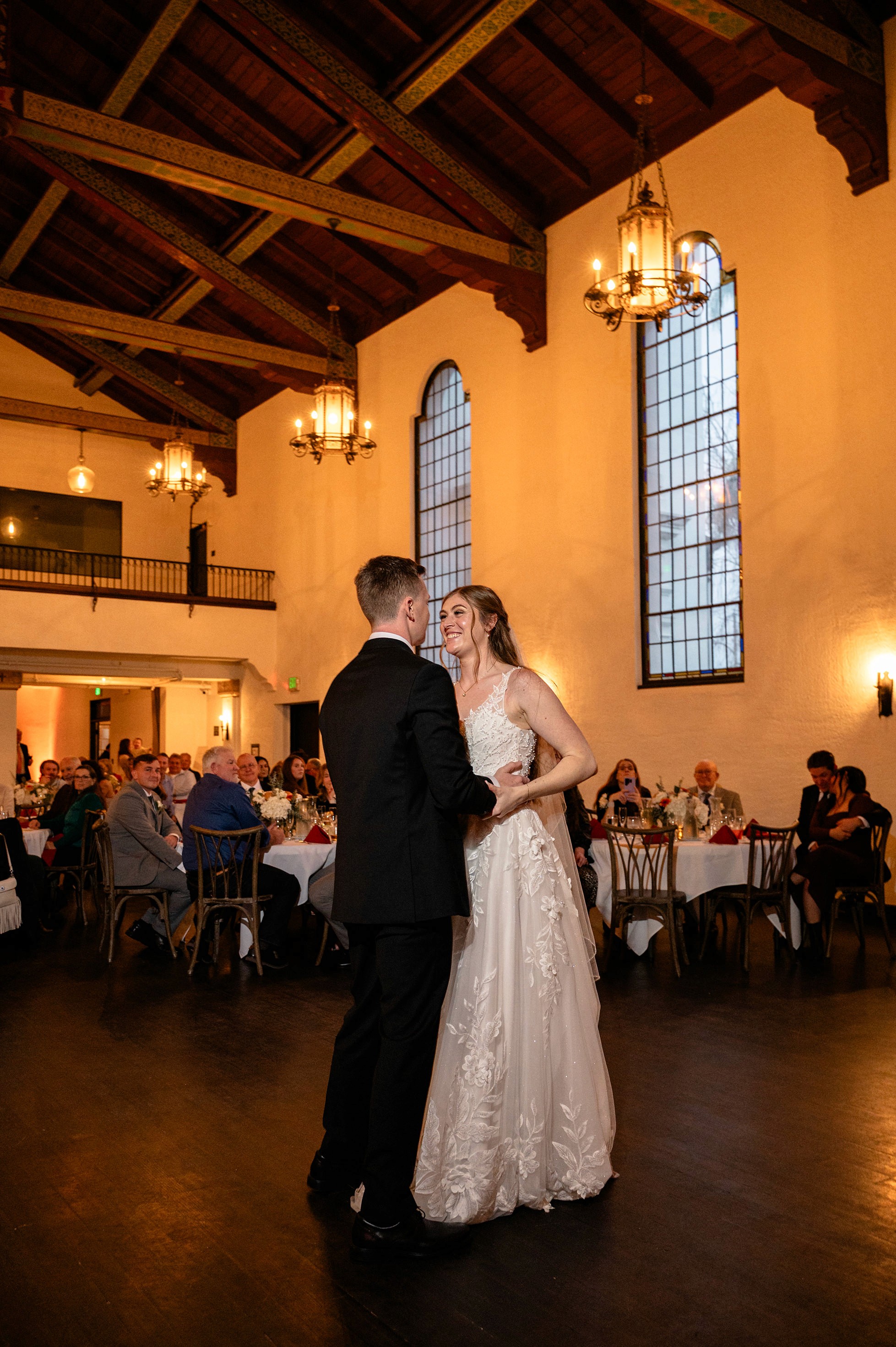 Flat lay wedding details with bouquet, rings, and sparkling bridal heels