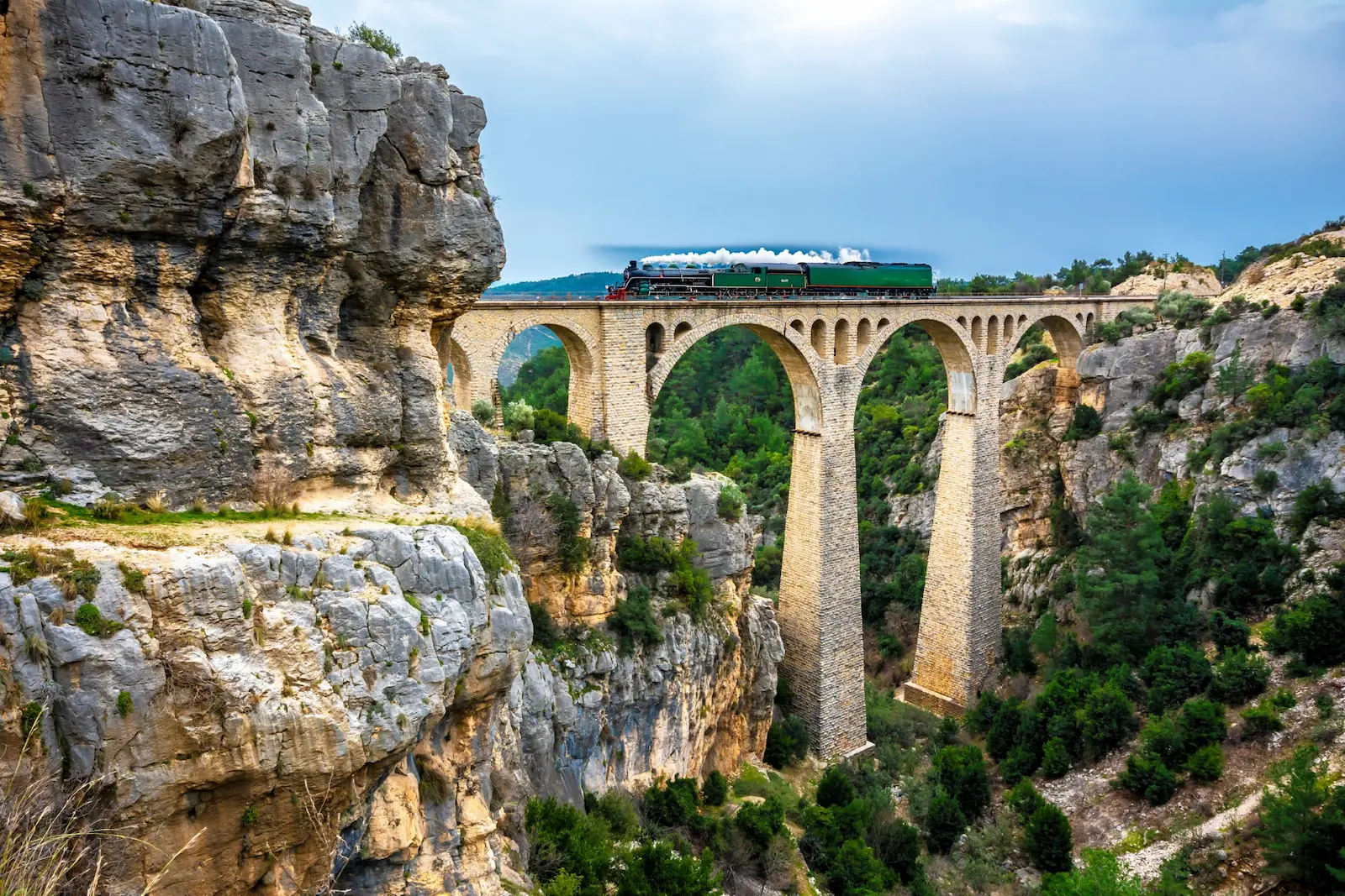 Historic stone railway bridge in Turkey symbolising cross-border connectivity, infrastructure, and long-term wealth structuring