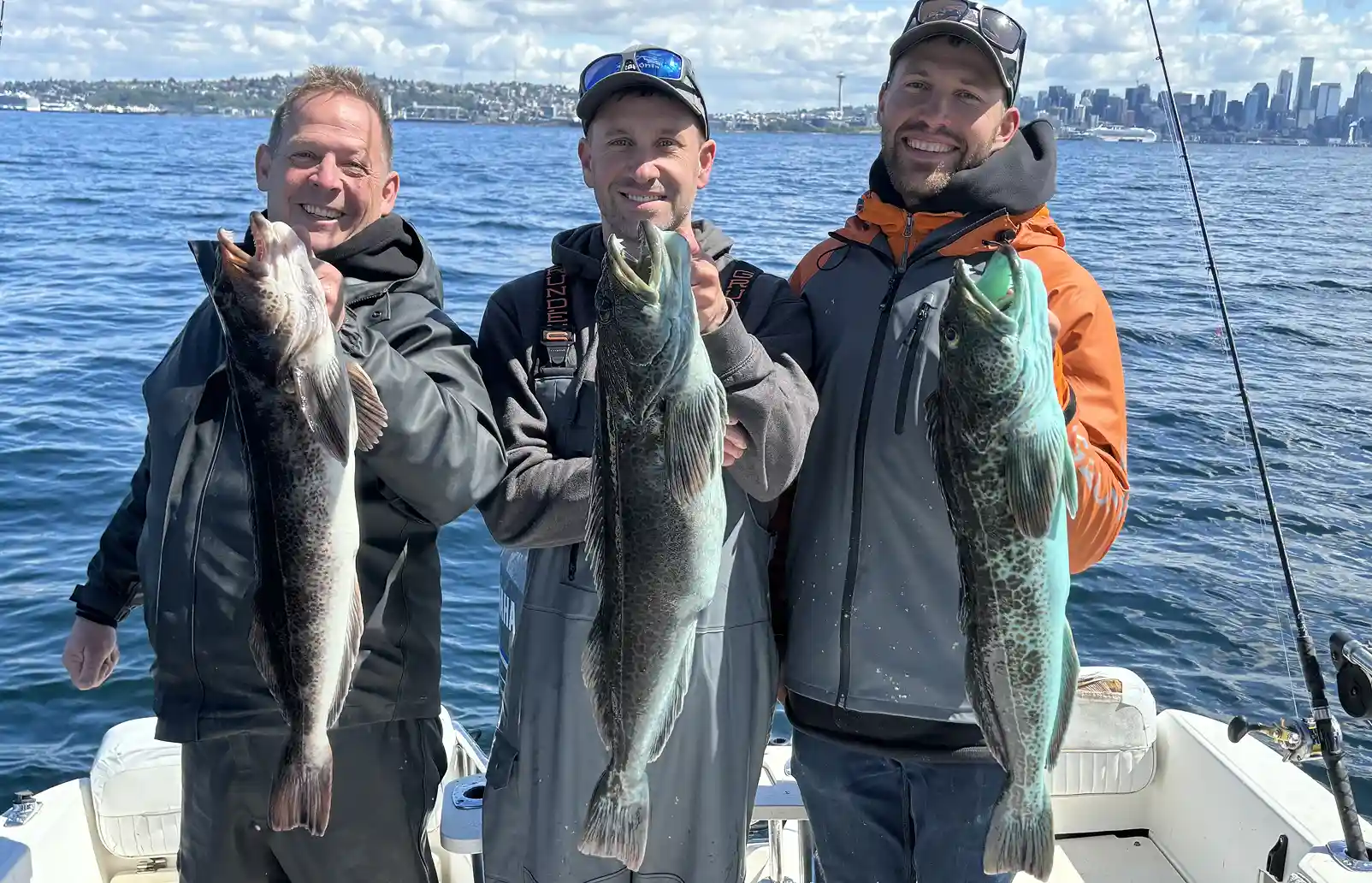 Group of guys holding blue lingcod fish