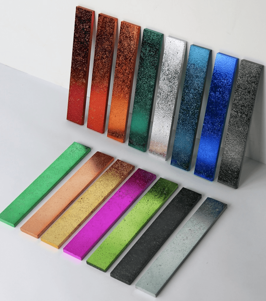 A variety of electroplated stone tiles in different vibrant colors, showcasing their metallic finishes and unique textures.