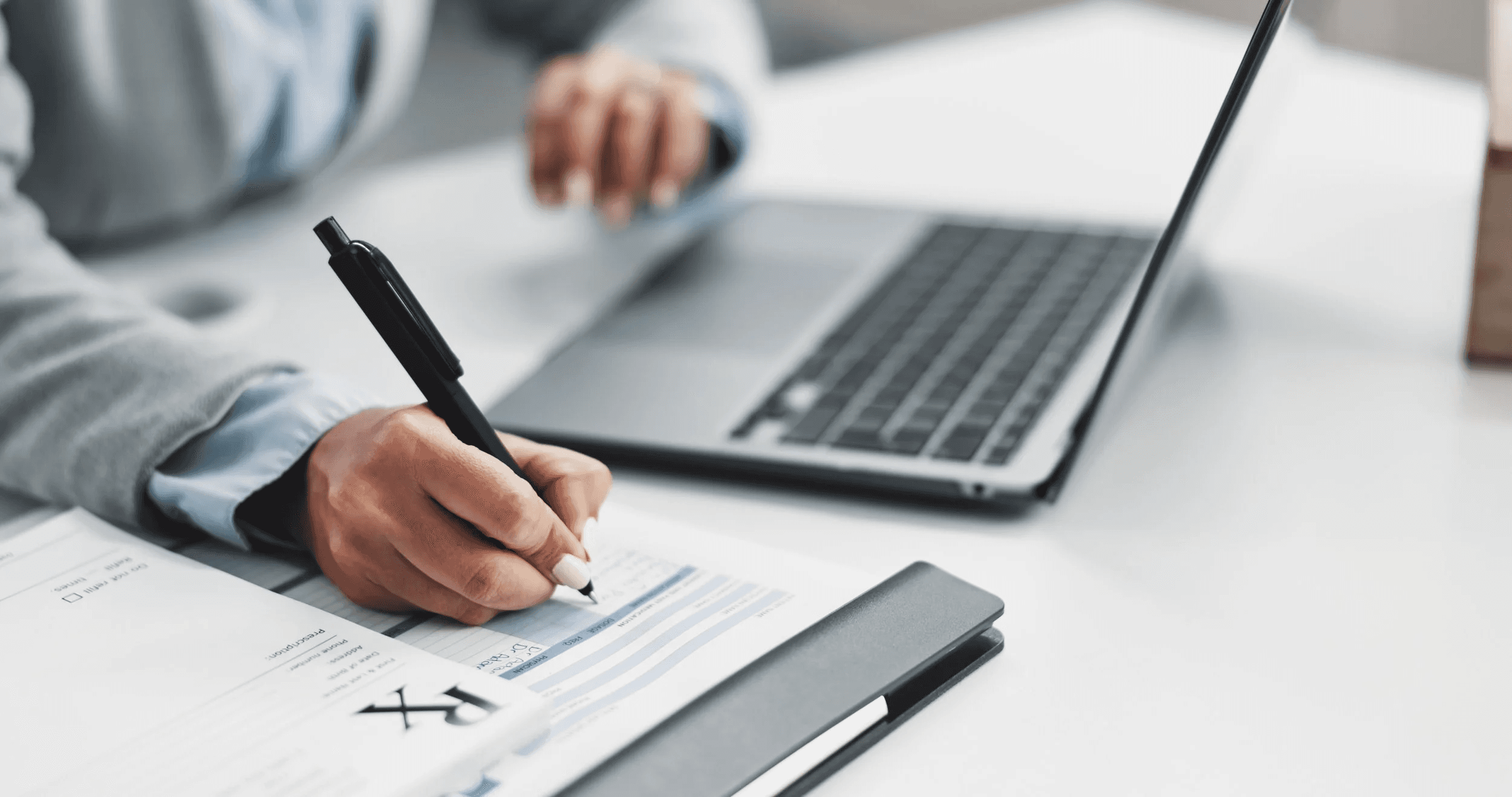  Doctor writing a medical prescription - Medical Report Writing