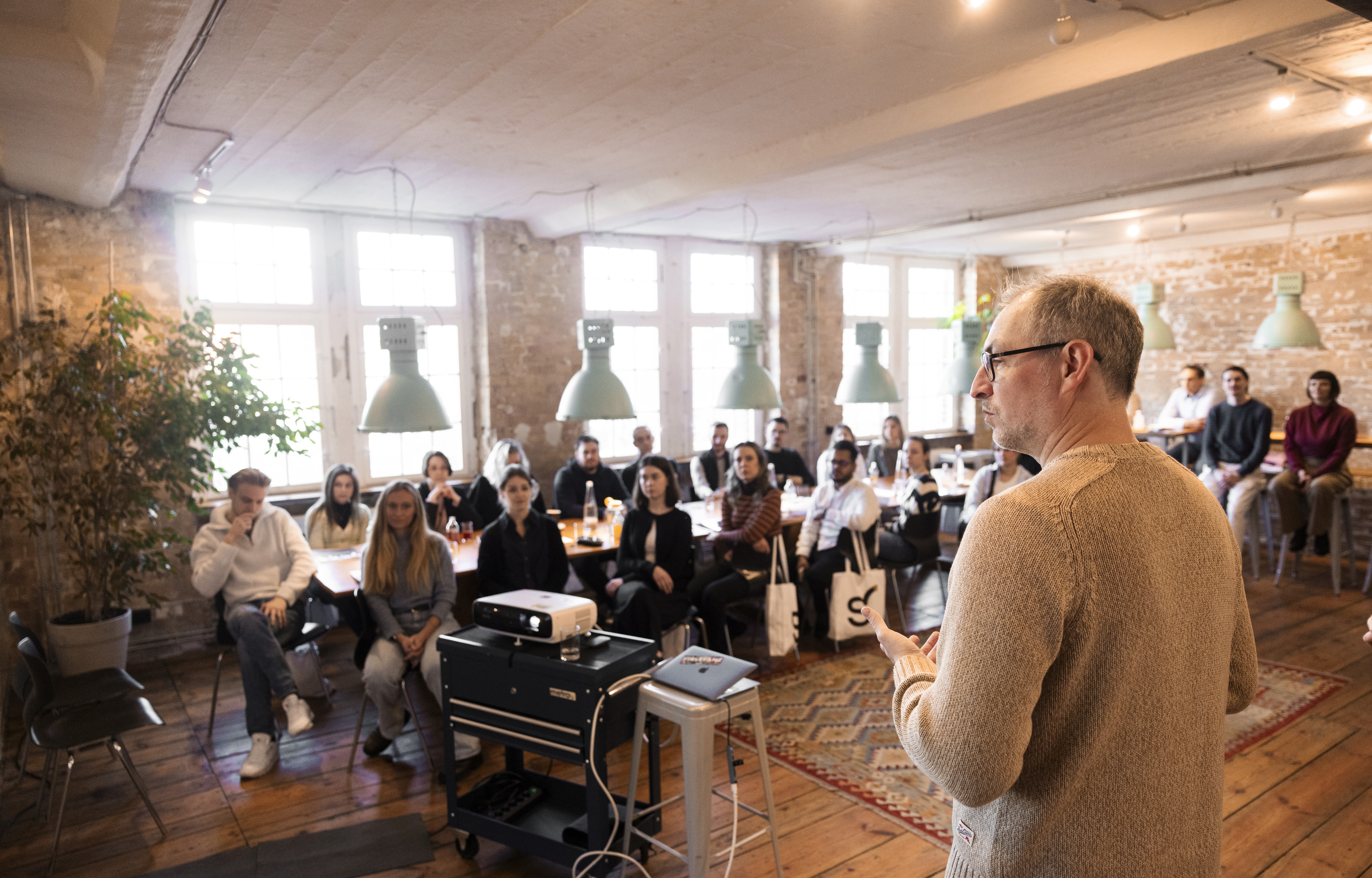 man in blue dress shirt and woman in black long sleeve shirt