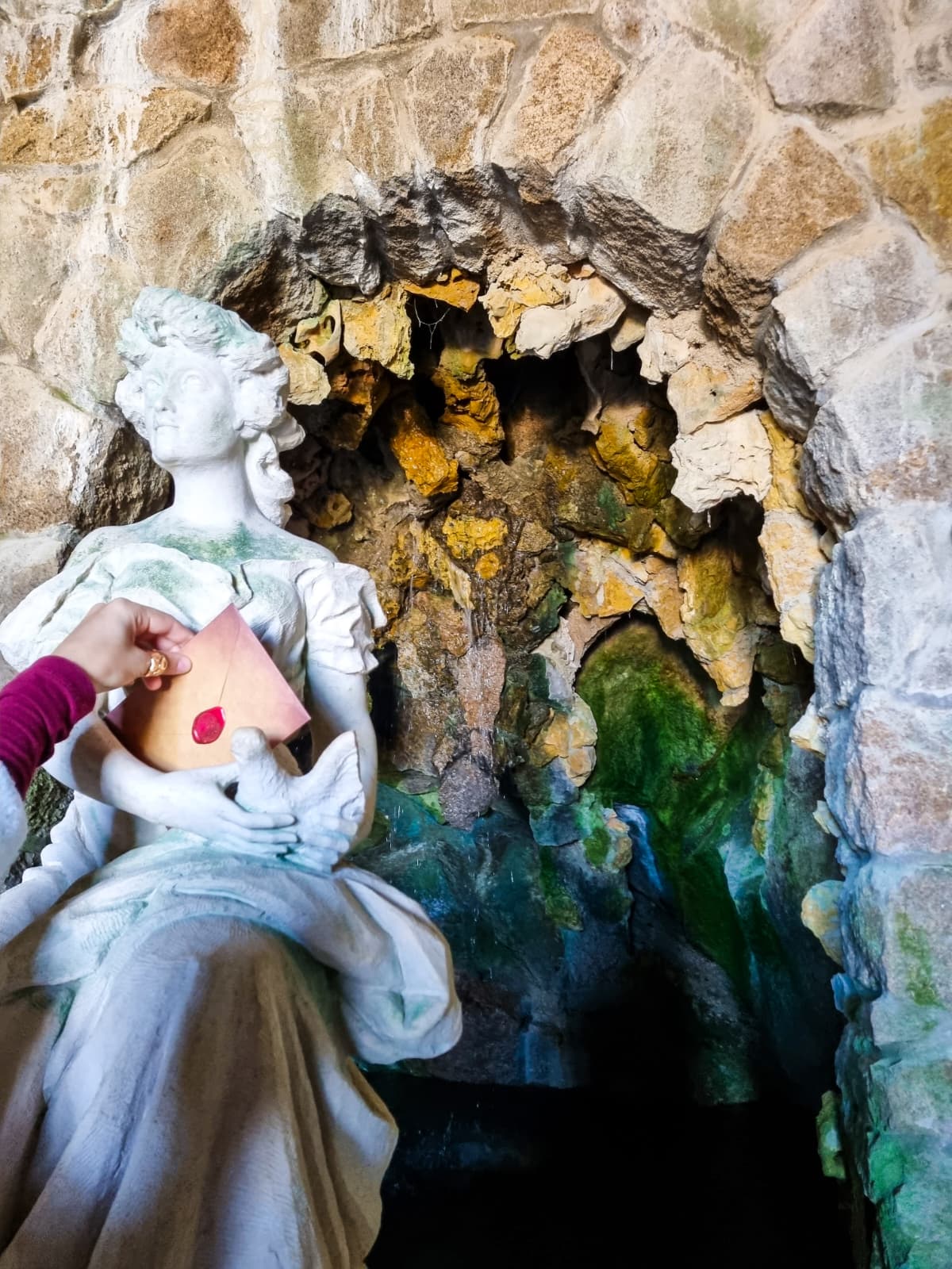 A cozy scene with warm sunlight casting stripes, featuring a potted plant and soft towels on a window sill.