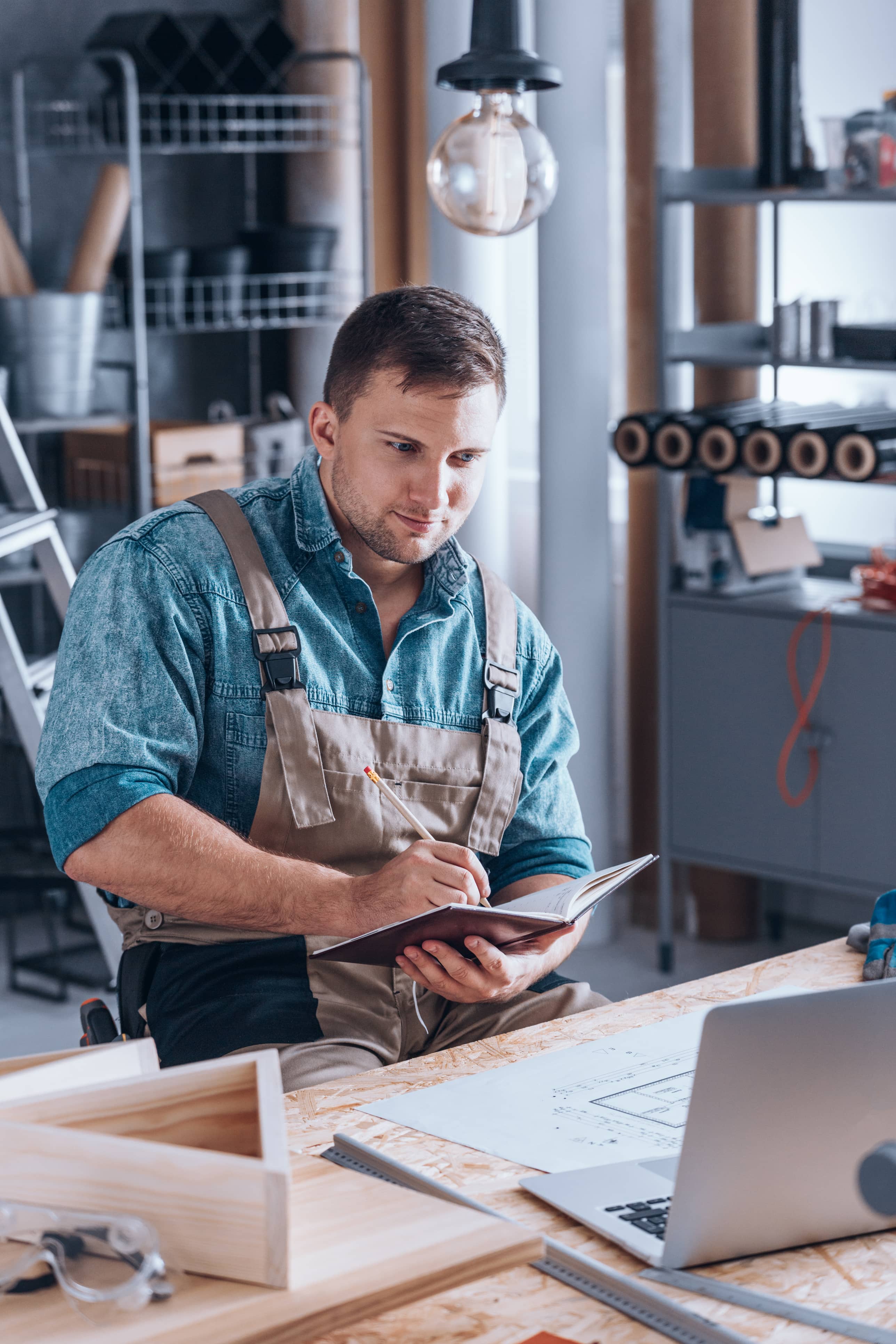 Small Workshop owner jotting down notes
