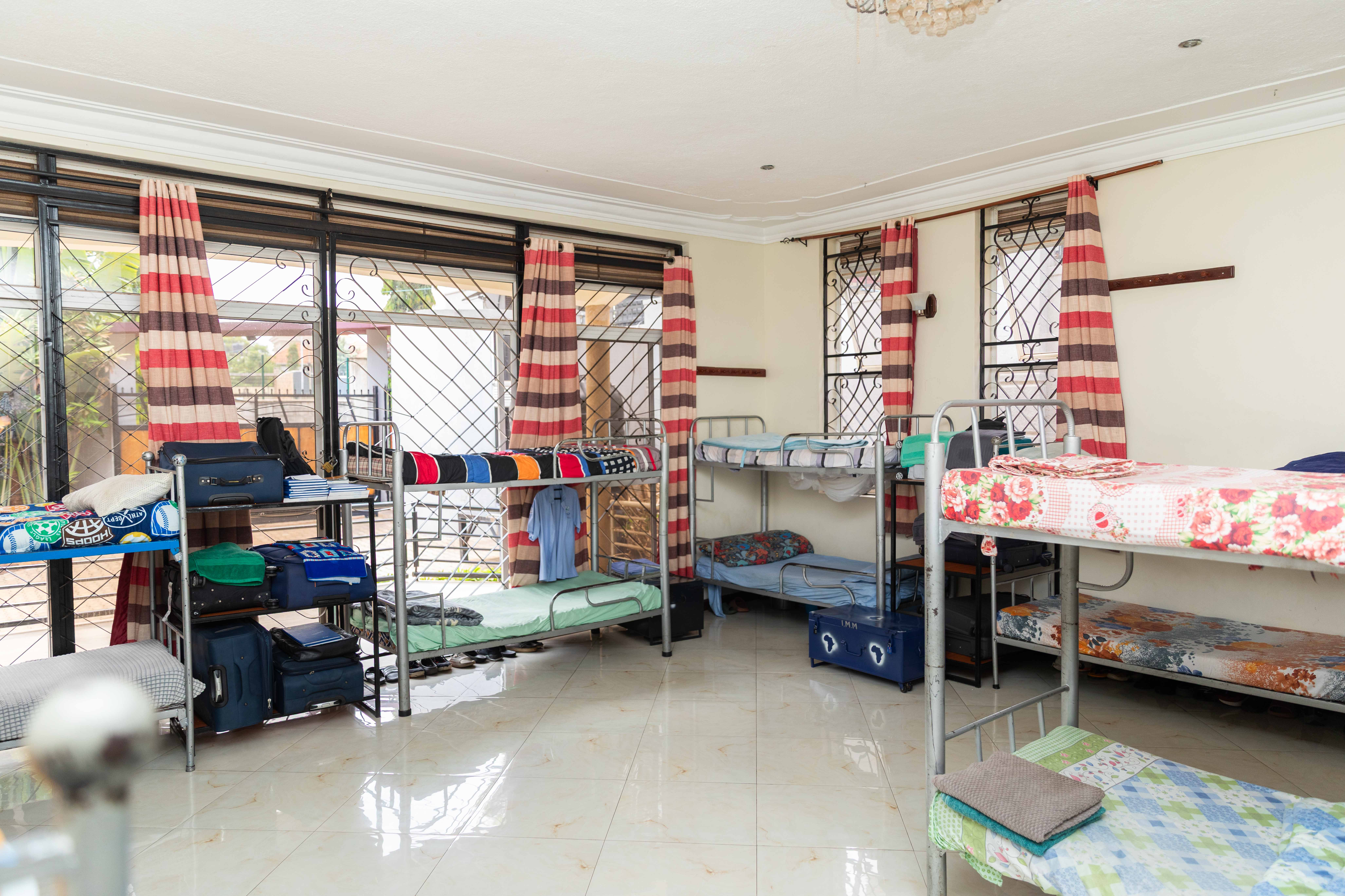 A student stands with a backpack on, ready for school