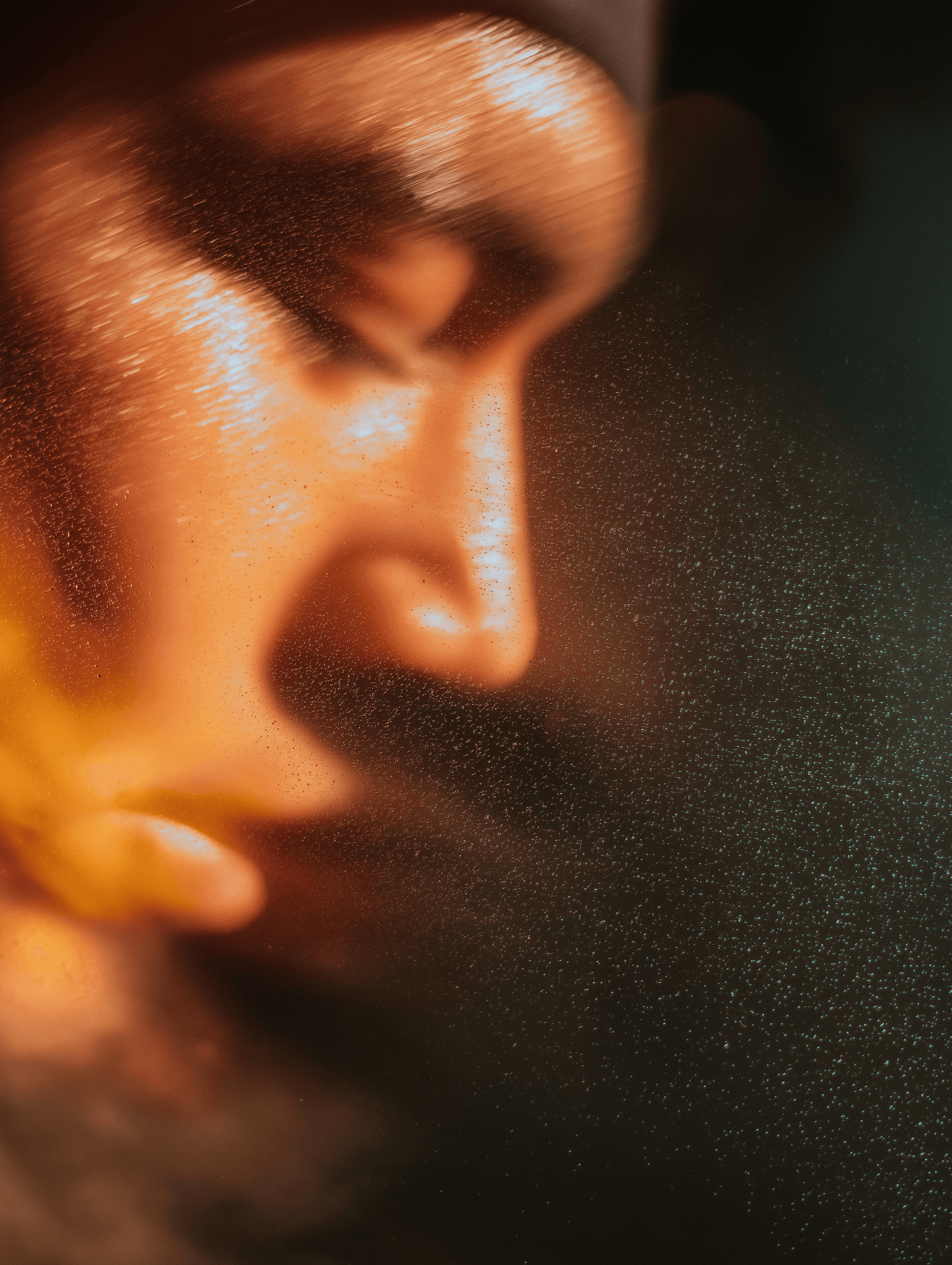 a person pouring water into a glass