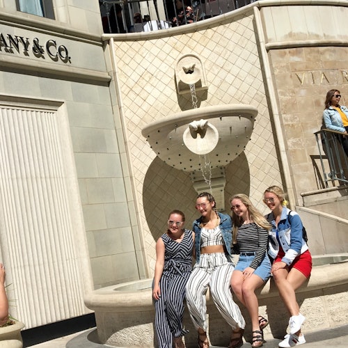 Posing for pictures on Rodeo Drive