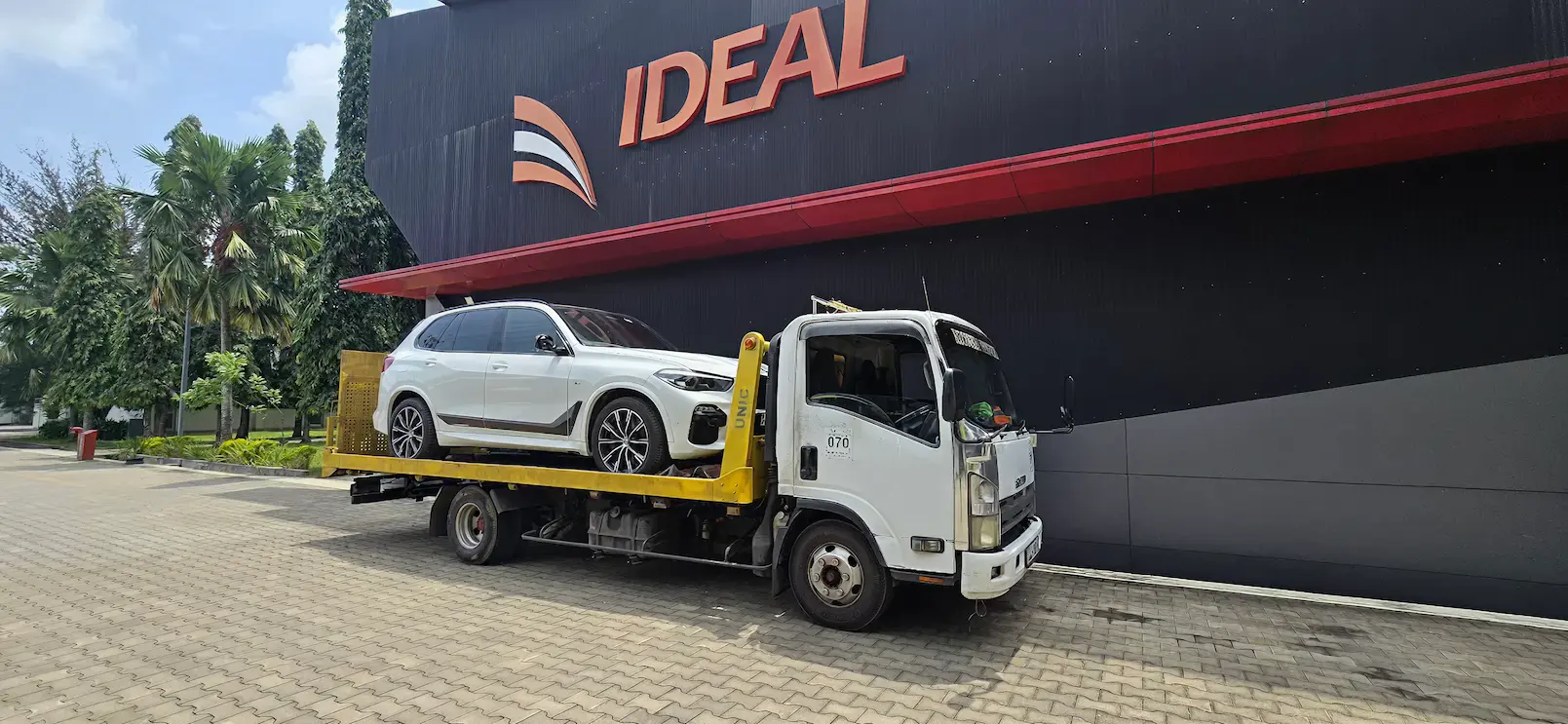 Car being towed on the road